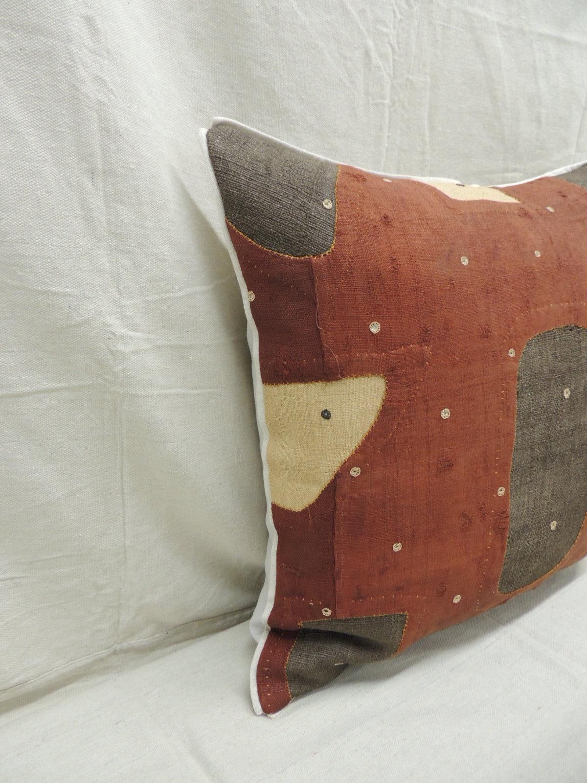 Applique raffia, patchwork and applique brown, rust and natural decorative pillow with,
Custom flat cotton trim in earth-tone khaki color all around. 
Grey cotton and linen backing. 
Pillow handcrafted and designed in the USA with custom made