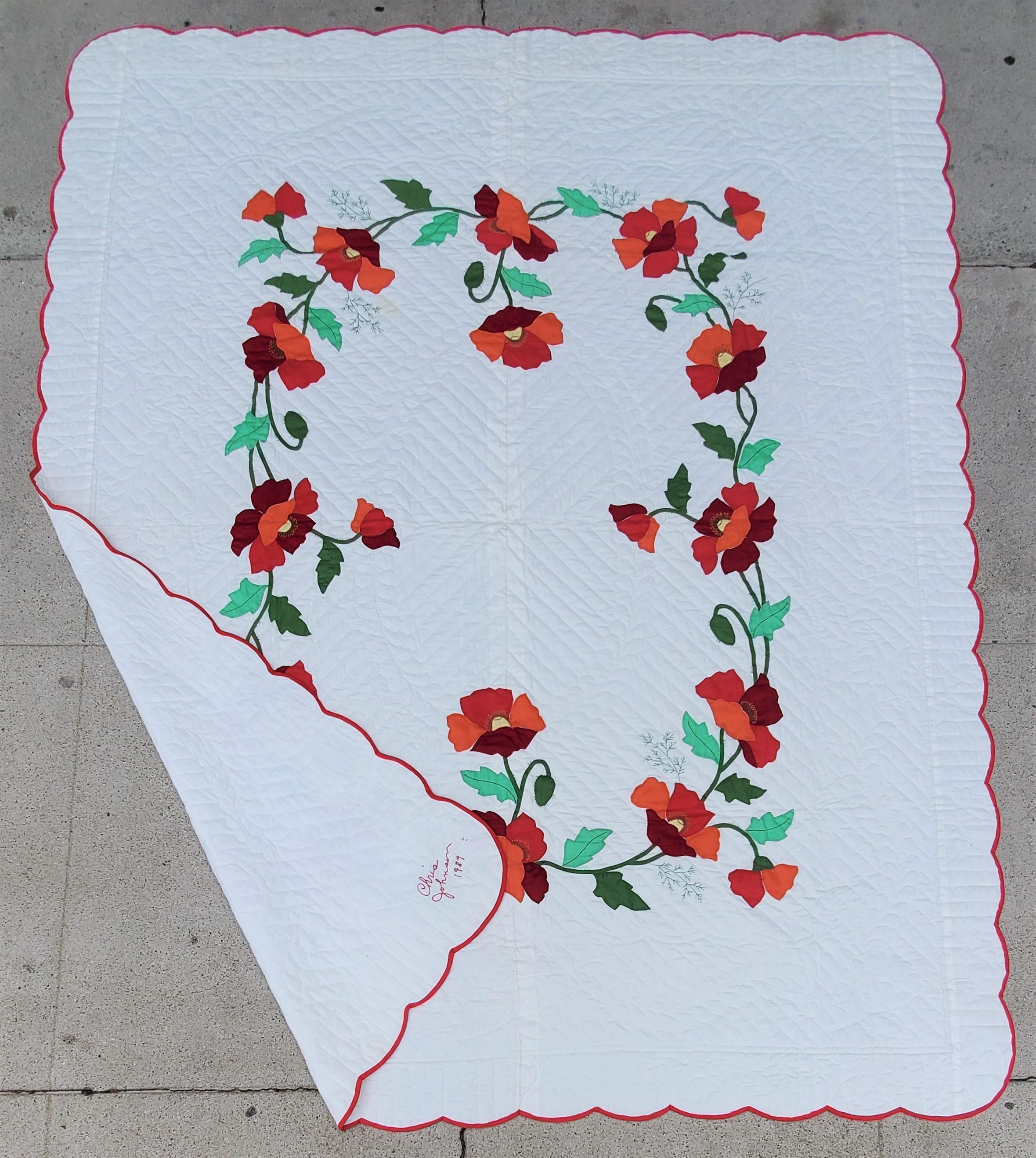 Signed and dated 1989 by Chris Johnson. Rose applique quilt with red border. The quilting has a floral and heart design which are shown in the images. Great applique quilt for any collection.