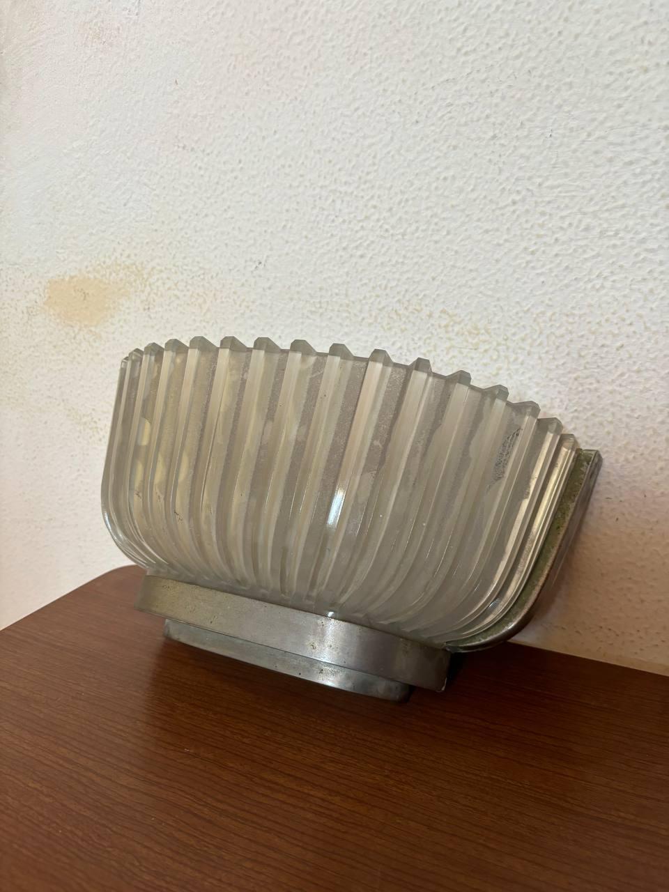 Archimede Seguso single glass wall sconce  and nickel  Seguso, 1930s.
The sconce was only revised in wiring, 1930s originality.
For interior decor, minimalist projects.
The nickel wall sconce draws two small bulbs for a softer light.
Shipping with