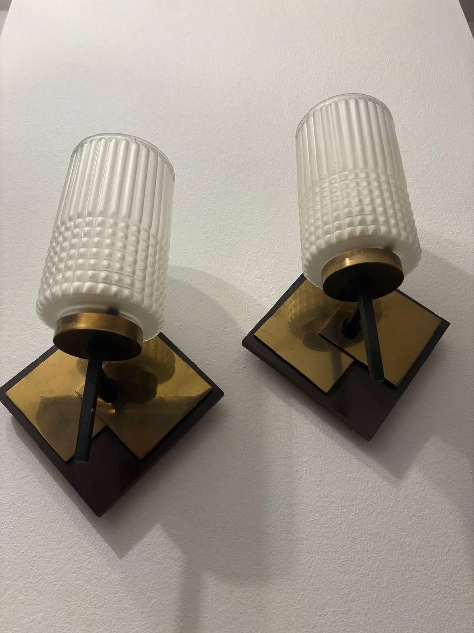Pair of mid-century wall sconces in textured glass and brass, 1950s
 functioning, cast iron, brass and glass materials ready for your environment 