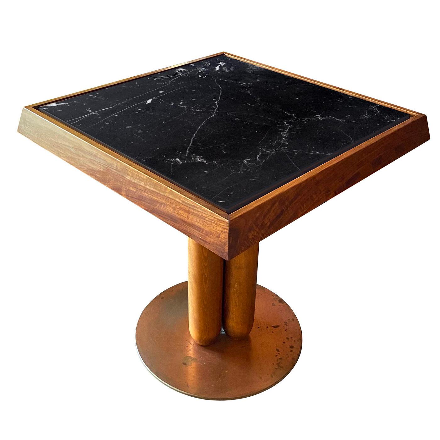 This refined coffee table is an original piece designed in 2014 by Ferdinando Meccani now part of a 2022 limited series of only ten numbered pieces. An outstanding element is the prized square top in black Marquinia marble, which is offered in an