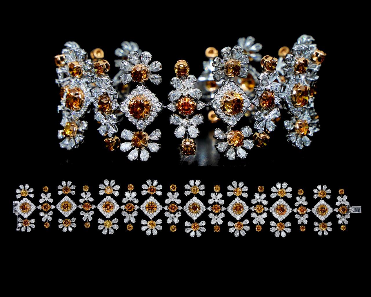 Peso bruto 50,46
Oro de 18 quilates Peso 45.312
Total 370 Diamantes Naranja y Blancos - 25,738 quilates Peso total del Diamante
Detalles del diamante 
FC Rnd Naranja Vs-Si 1/10	8pieces	0,811 quilates
FC Rnd Naranja Vs-Si 1/6	10pieces	1,742