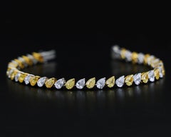 Bracciale di diamanti gialli e bianchi valutato 9,33 carati