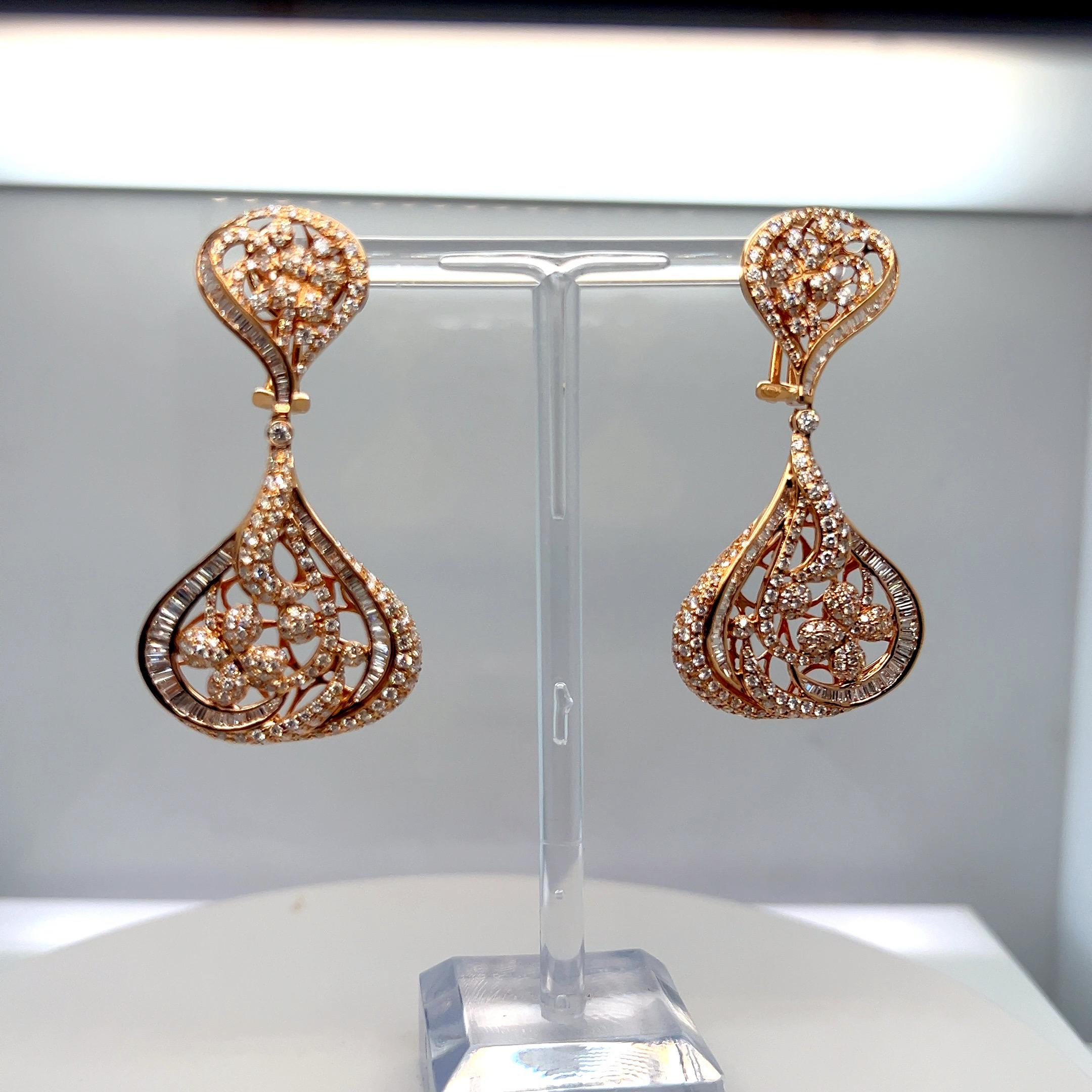 These stunning approximately 5.90-carat mixed cut (full cut and baguette) diamond chandelier earrings feature a French clip post back style and an exquisite design crafted in 14k rose gold. The earrings offer an elevated, sophisticated look and are