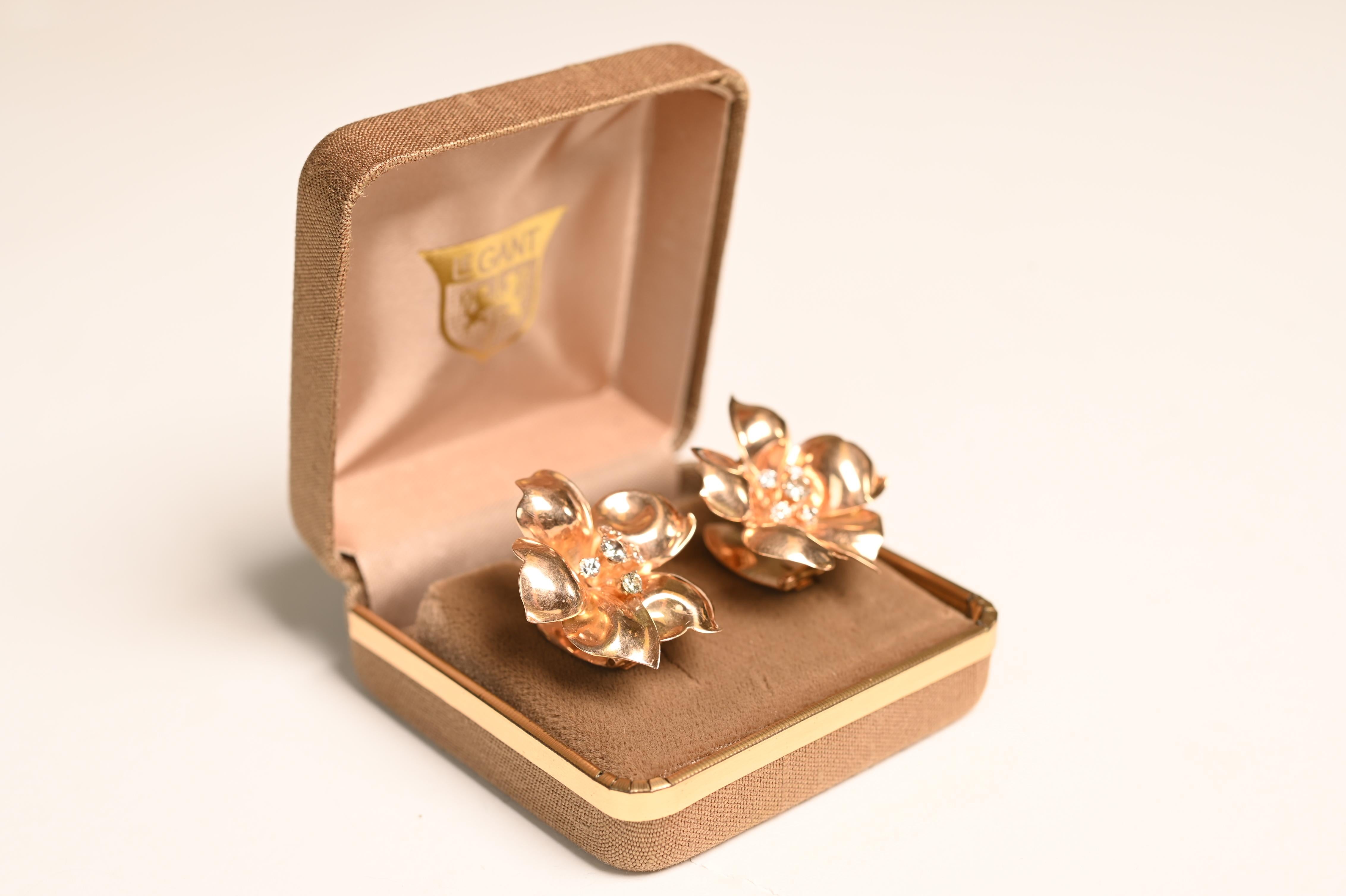 A stunning pair of vintage floral-style gold clip-on earrings, these exquisite pieces showcase the elegance and craftsmanship of the Retro era, dating back to circa 1940. Handcrafted in luxurious 18k rose gold, the earrings feature a beautifully