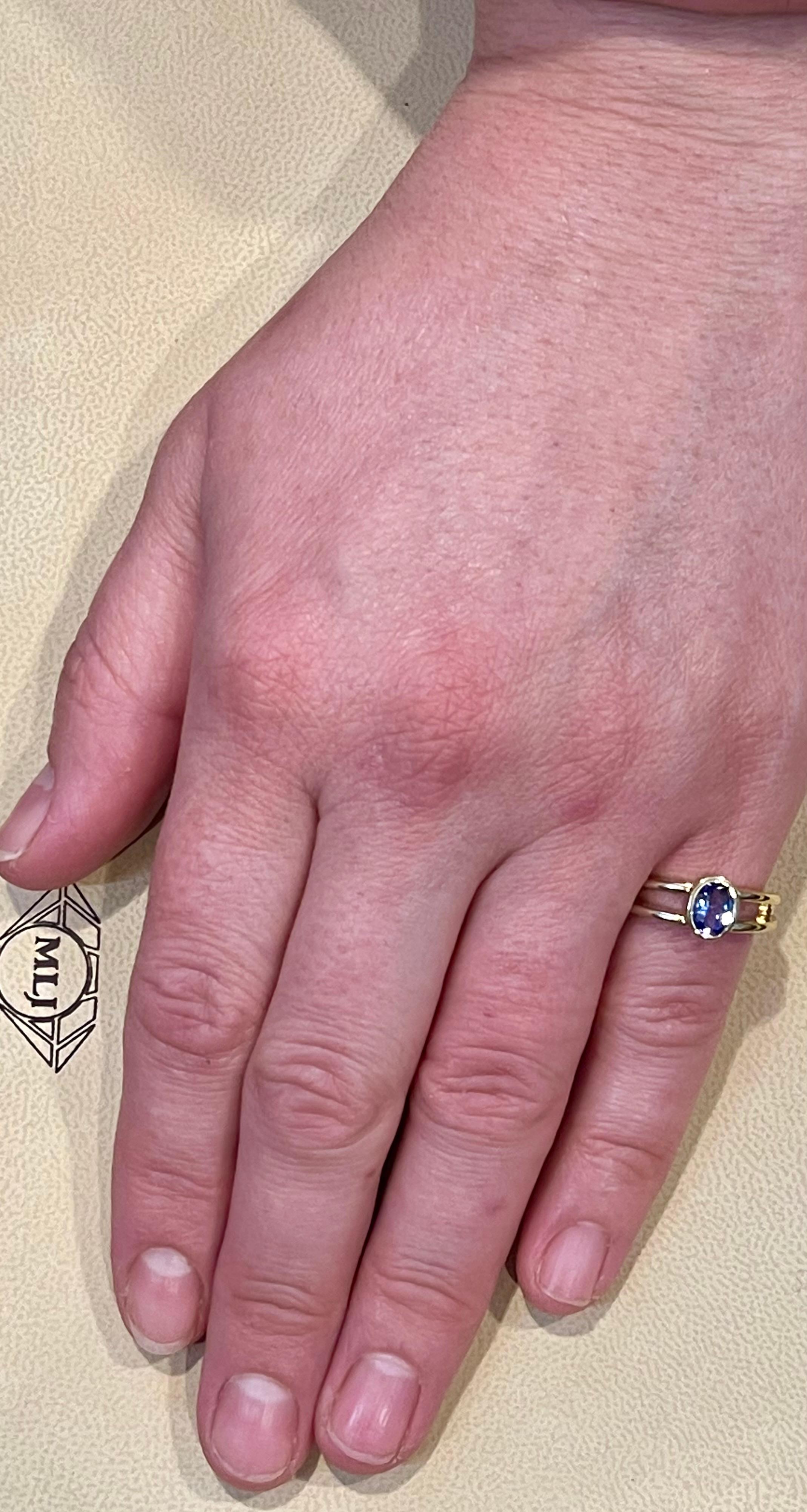 Approximately 0.75 Carat Oval Shape Tanzanite Ring 14 Karat Yellow Gold 4