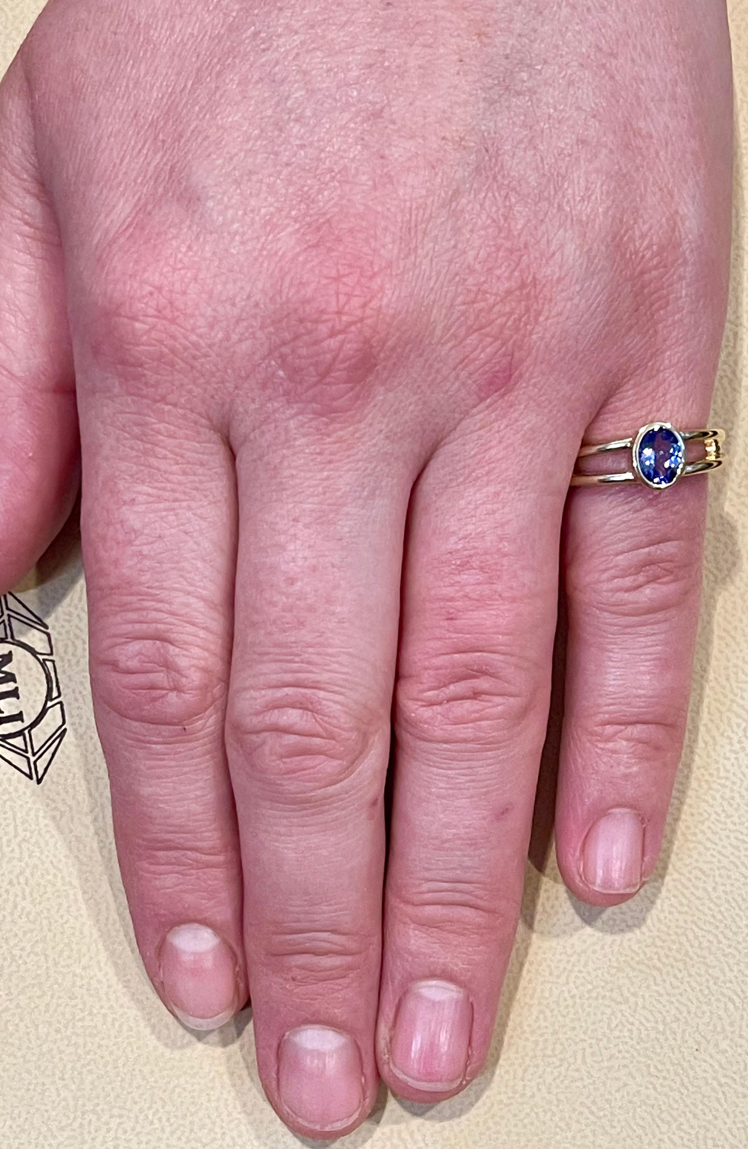 Approximately 0.75 Carat Oval Shape Tanzanite Ring 14 Karat Yellow Gold 7