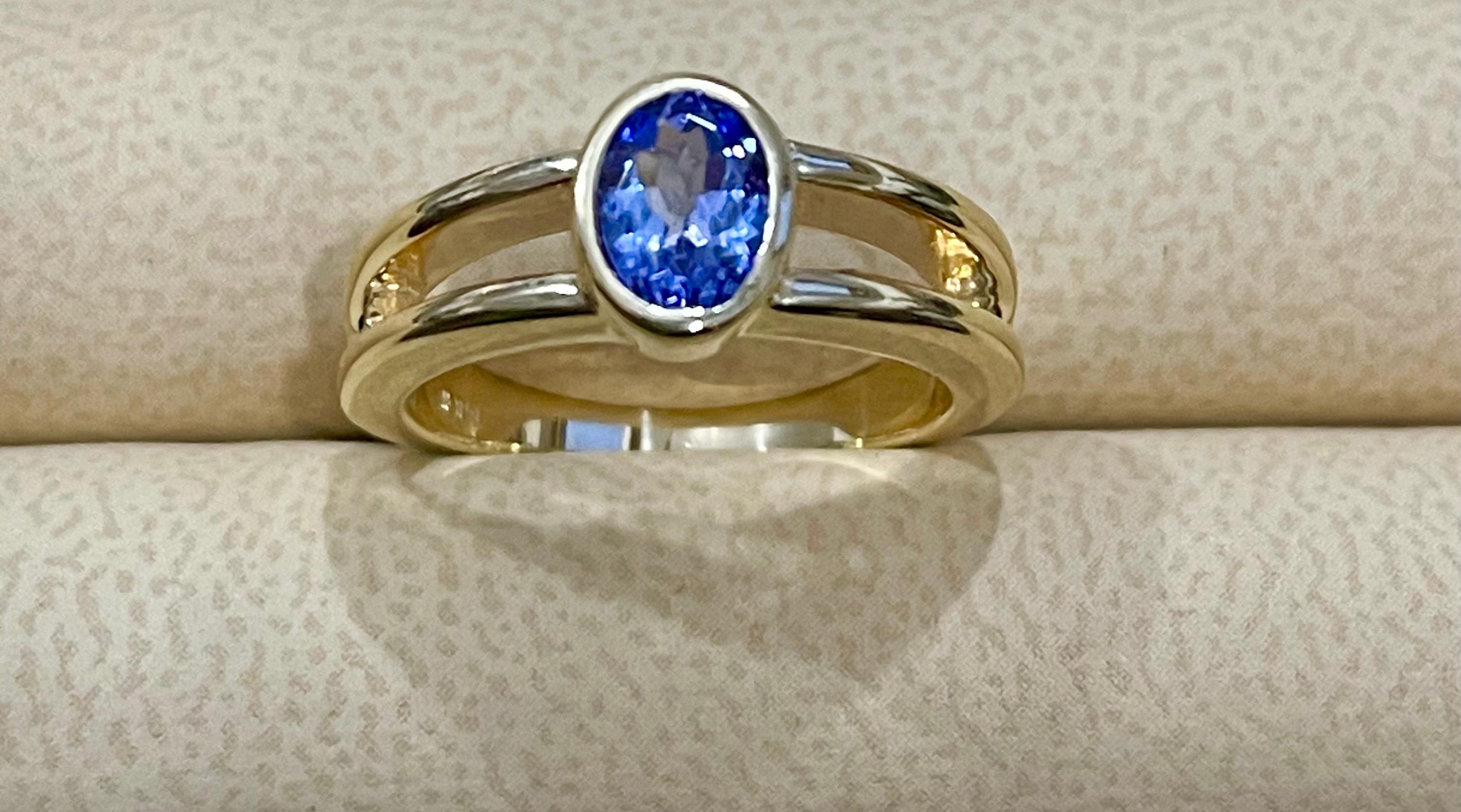 Approximately 0.75 Carat Oval Shape Tanzanite Ring 14 Karat Yellow Gold
Very Affordable Ring on Closeout Prices
Nice medium quality Tanzanite of nice blue shade.
14 Karat Yellow Gold 5.4 Gram
Stamped 14 K

This ring is on clearance and is priced
