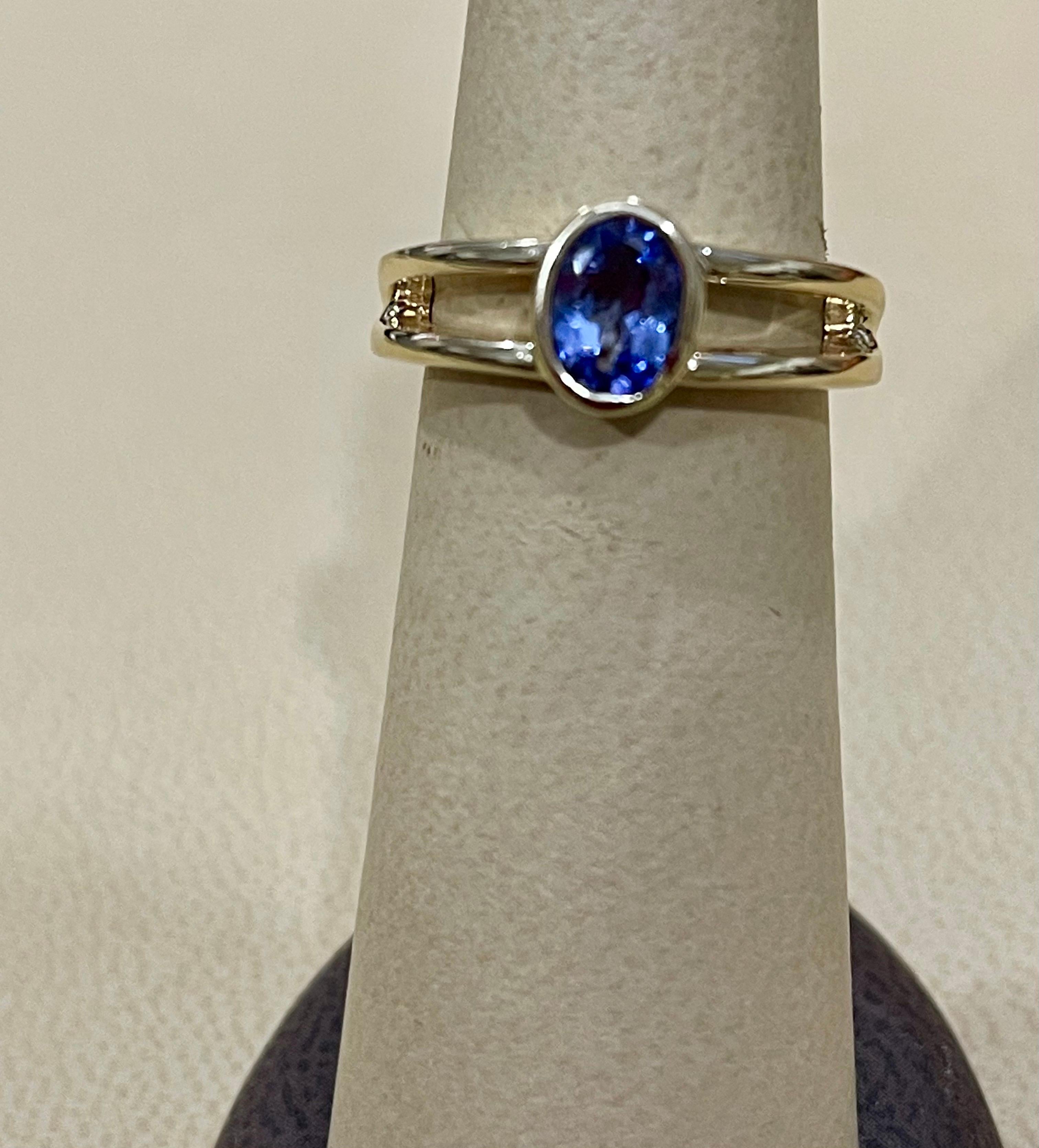 Approximately 0.75 Carat Oval Shape Tanzanite Ring 14 Karat Yellow Gold 1