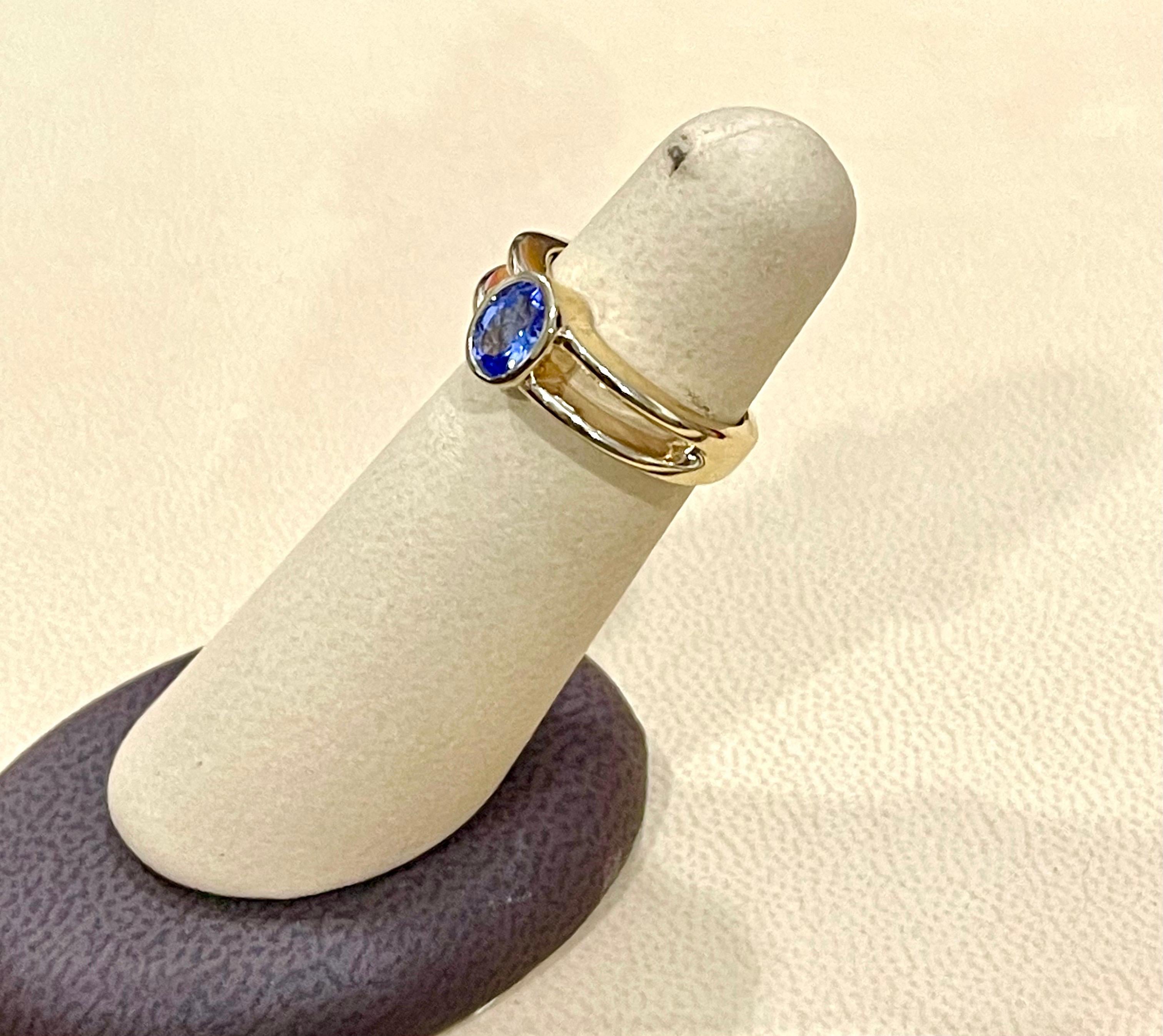 Approximately 0.75 Carat Oval Shape Tanzanite Ring 14 Karat Yellow Gold 2