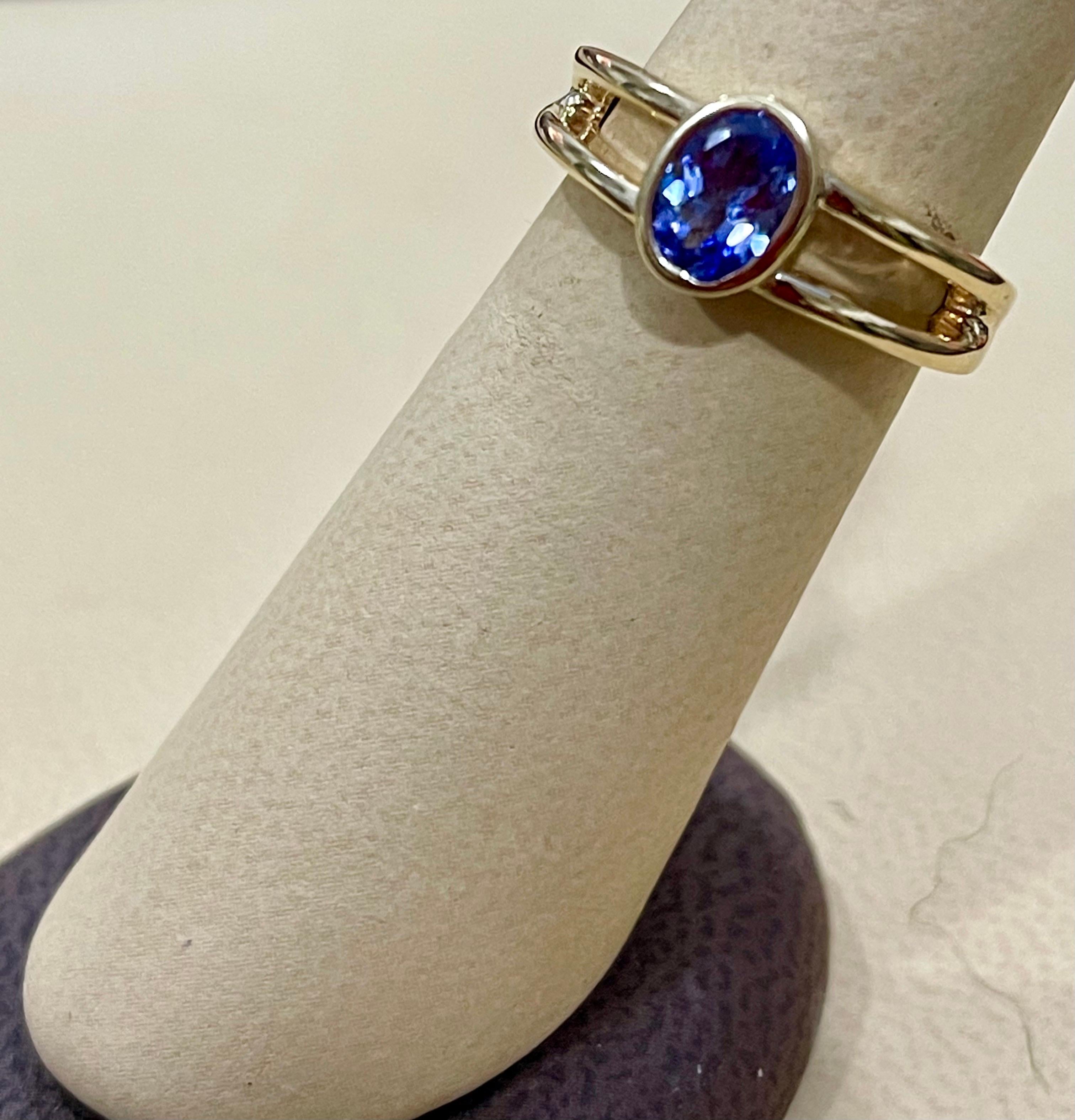 Approximately 0.75 Carat Oval Shape Tanzanite Ring 14 Karat Yellow Gold 3