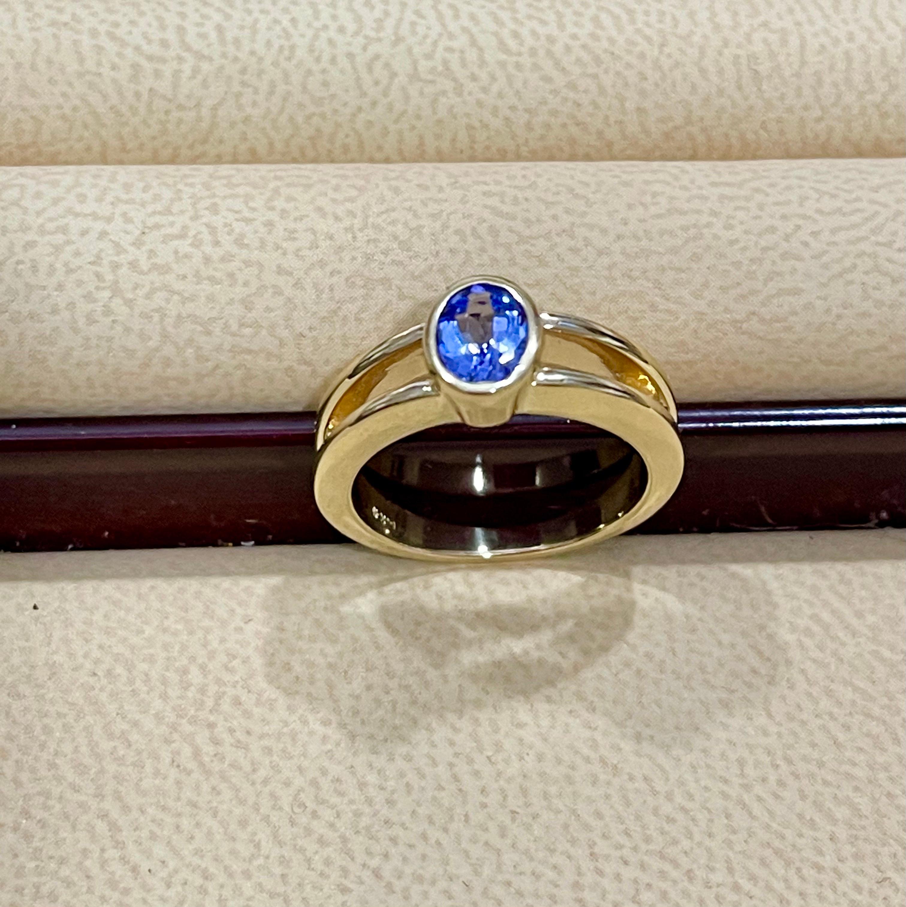 Approximately 0.75 Carat Oval Shape Tanzanite Ring 14 Karat Yellow Gold 5