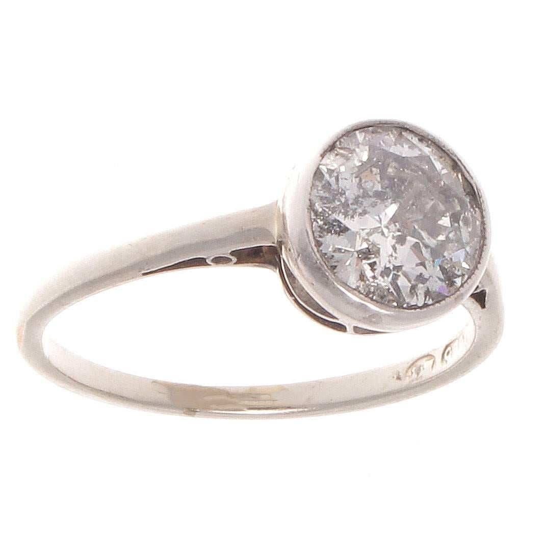 A new creation with old implications. Moon, soon, let's get hooked in June. The classic solitaire engagement ring featuring an approximately 1.25 carat diamond that is H-I color, pique clarity. Hand crafted in platinum. 

Ring size 6-1/2 and can be
