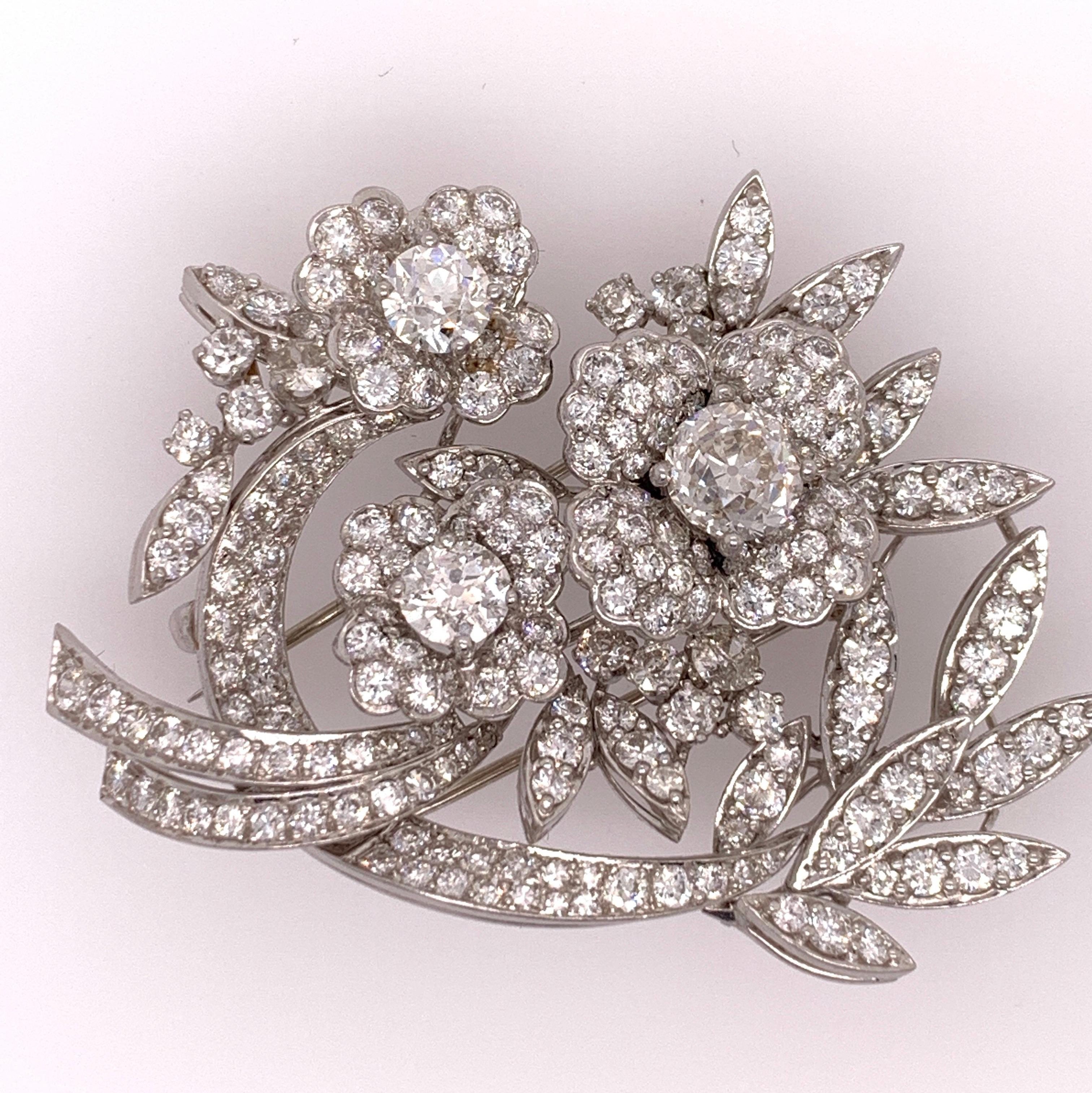 

Magnificent Rare Estate Platinum Brooch & Pendant. Approximately 11 carats of Natural old euro and round diamonds, 216 stones total.

The piece weighs 35 grams, Can be worn as a pendant or a brooch. It is handmade in platinum, brooch and pendant