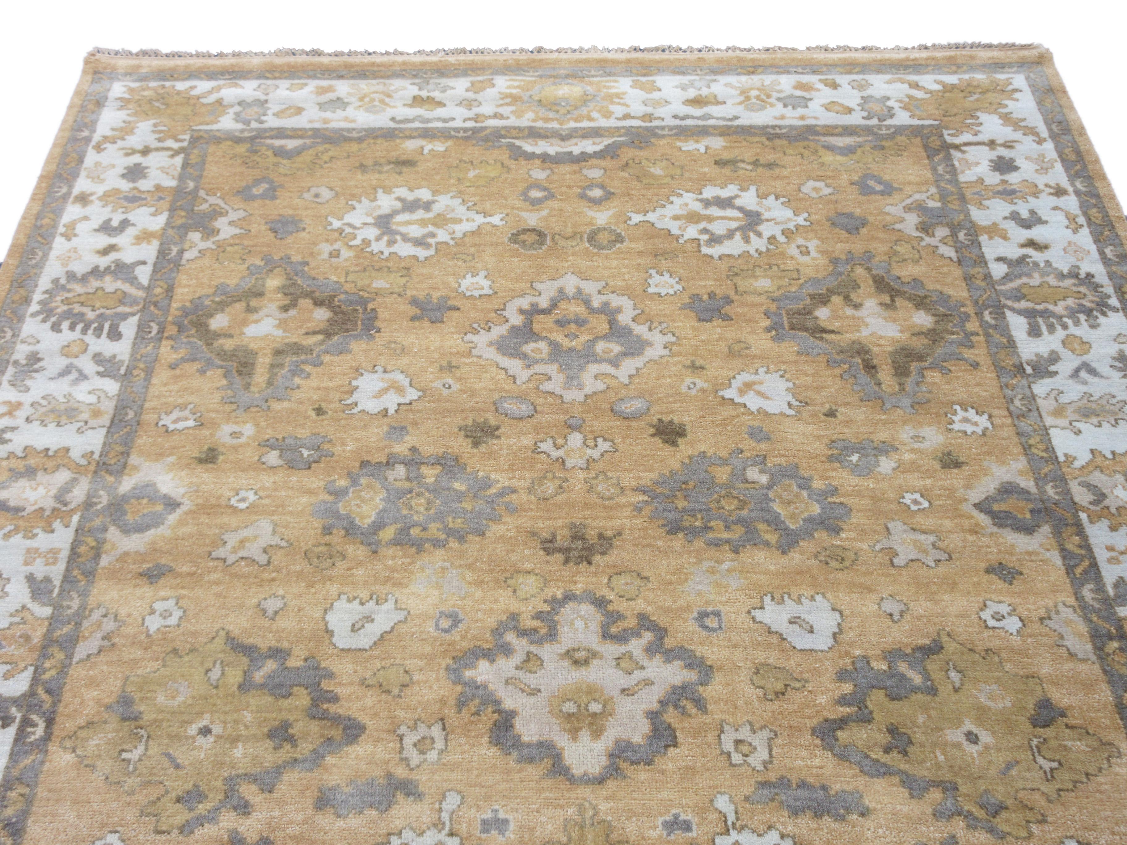 Hand-knotted, wool pile on a cotton foundation.

Dimensions: 8' x 10'

Origin: India

Field Color: Apricot

Border Color: Light-Blue

Accent colors: brown, grey.