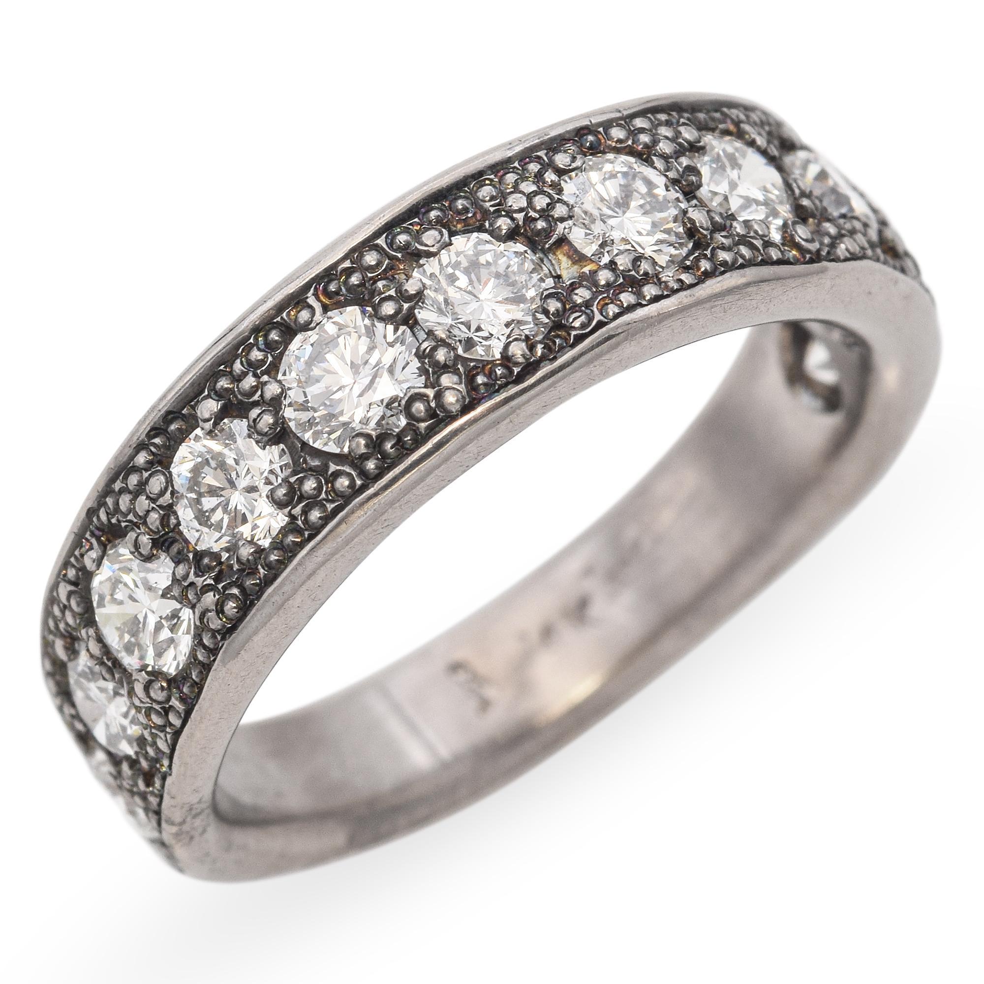 Made by April Higashi C. 2000s
This artisanal band ring by April Higashi is crafted in 14k white gold and features a subtle patina finish that adds depth and character. Scattered diamonds are flush-set into the band, offering a delicate sparkle with