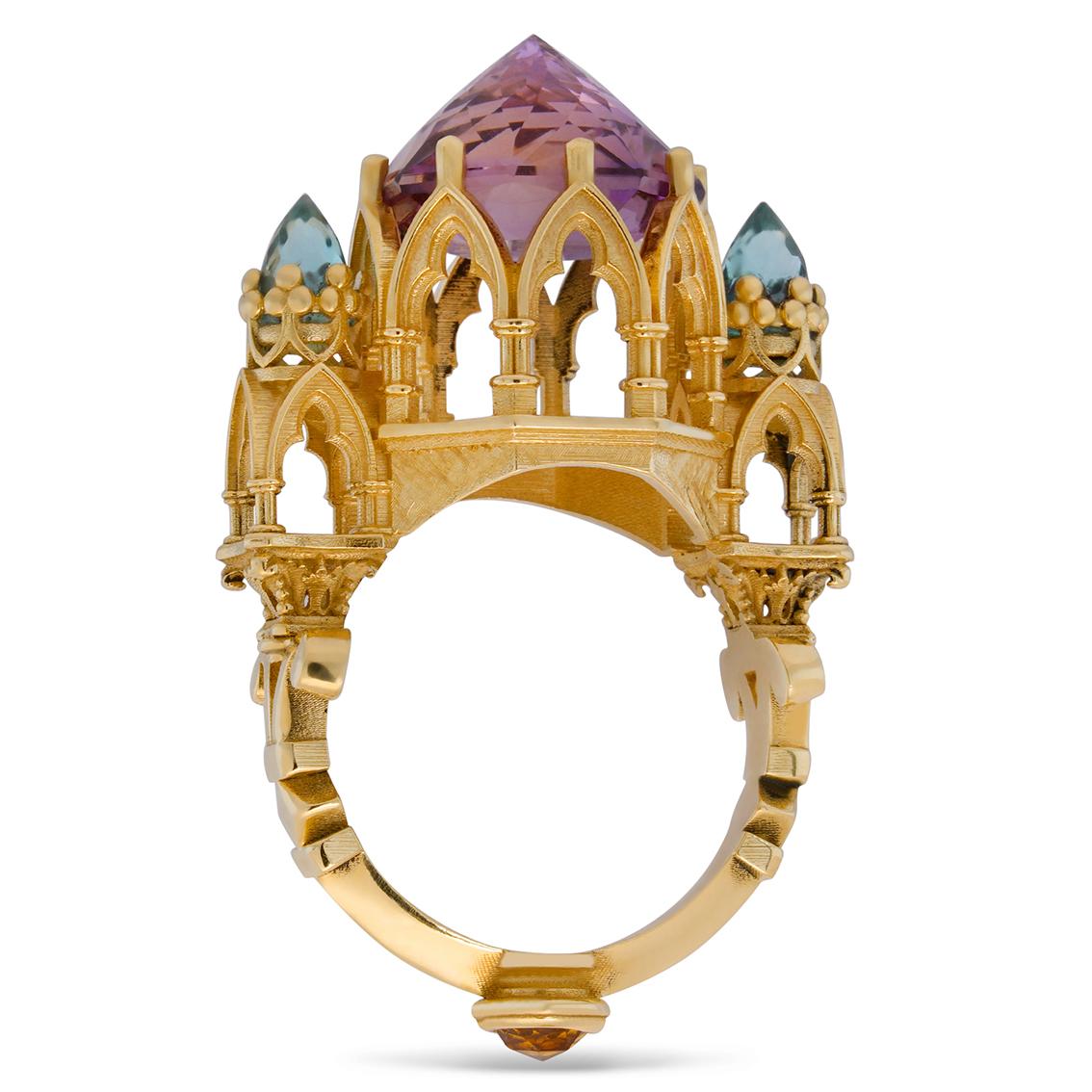 Conjuring the rich blue, purple, and gold hues of the famed stained glass windows in the Apse of Sainte-Chapelle France, this enchanting ring is a truly marvellous one of a kind piece.

Exquisitely handcrafted in 9kt yellow gold this stunning ring