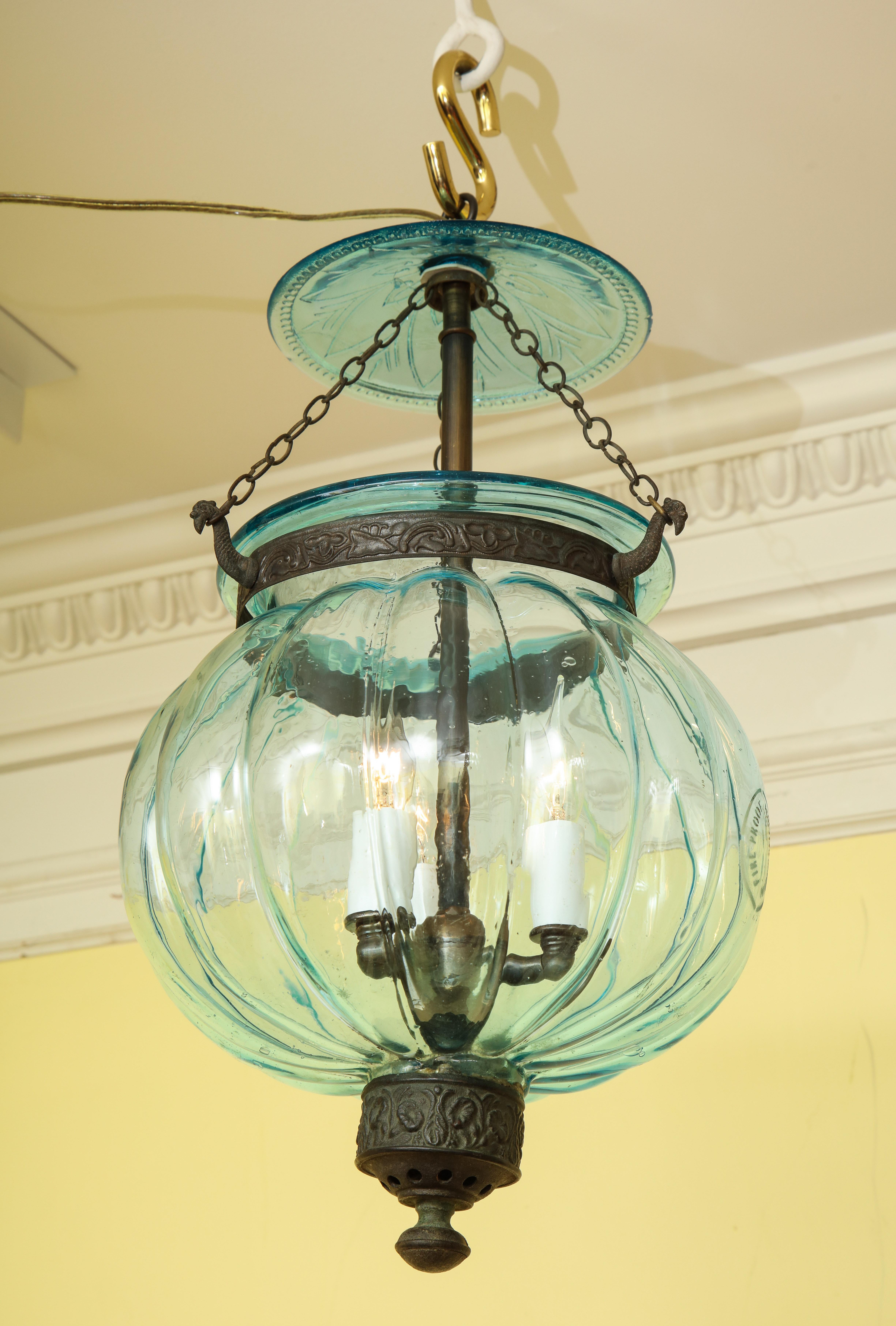 Fine aqua blue melon form glass three-light Lantern having a stamped glass lid with matching blue lobed body. Stamped 