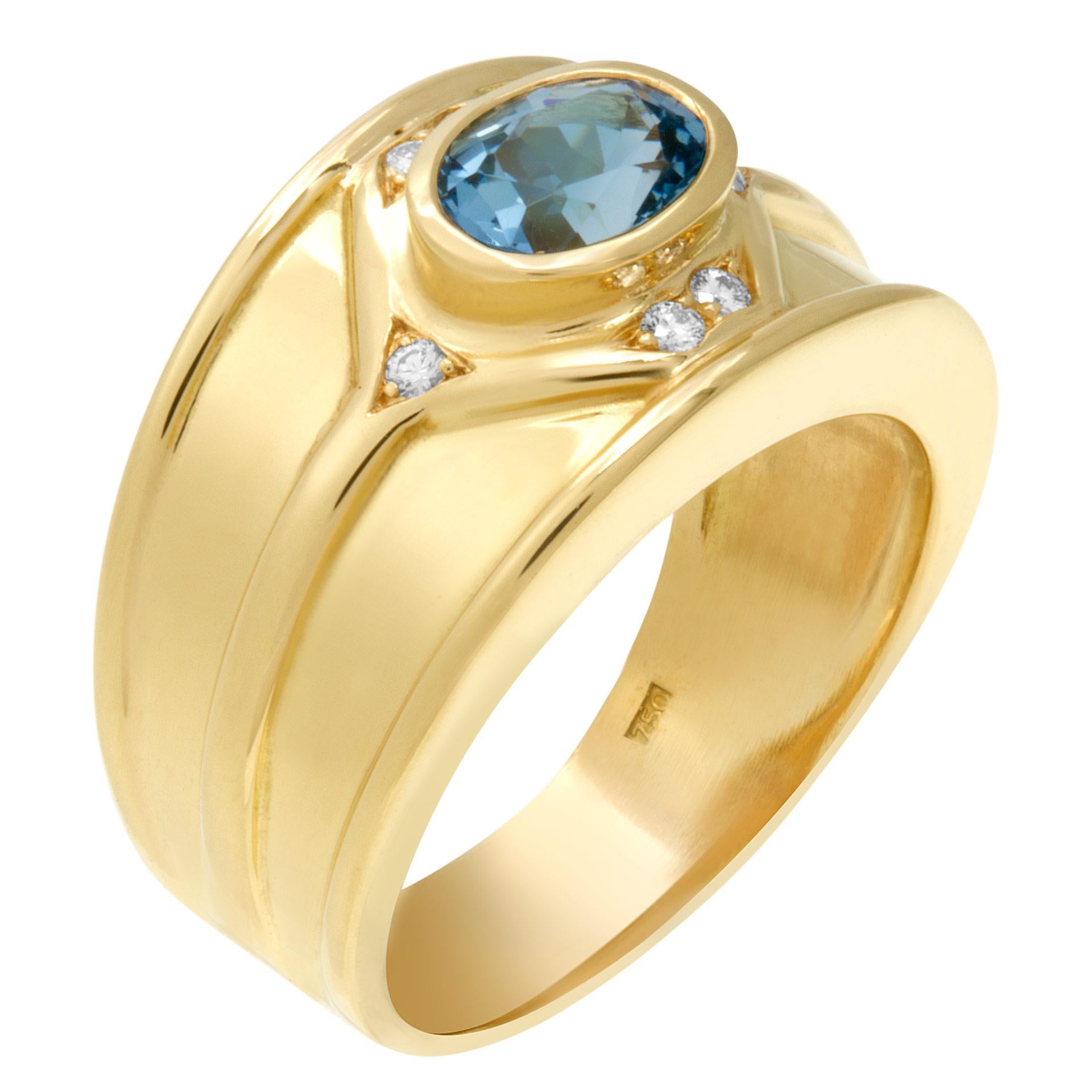 Aqua blue topaz ring with approximately 0.10 carat in diamond accents set in 18k gold. Width at head: 12.5mm, with at shank: 4.8mm. Size 8.

This Diamond ring is currently size 8 and some items can be sized up or down, please ask! It weighs 8.6