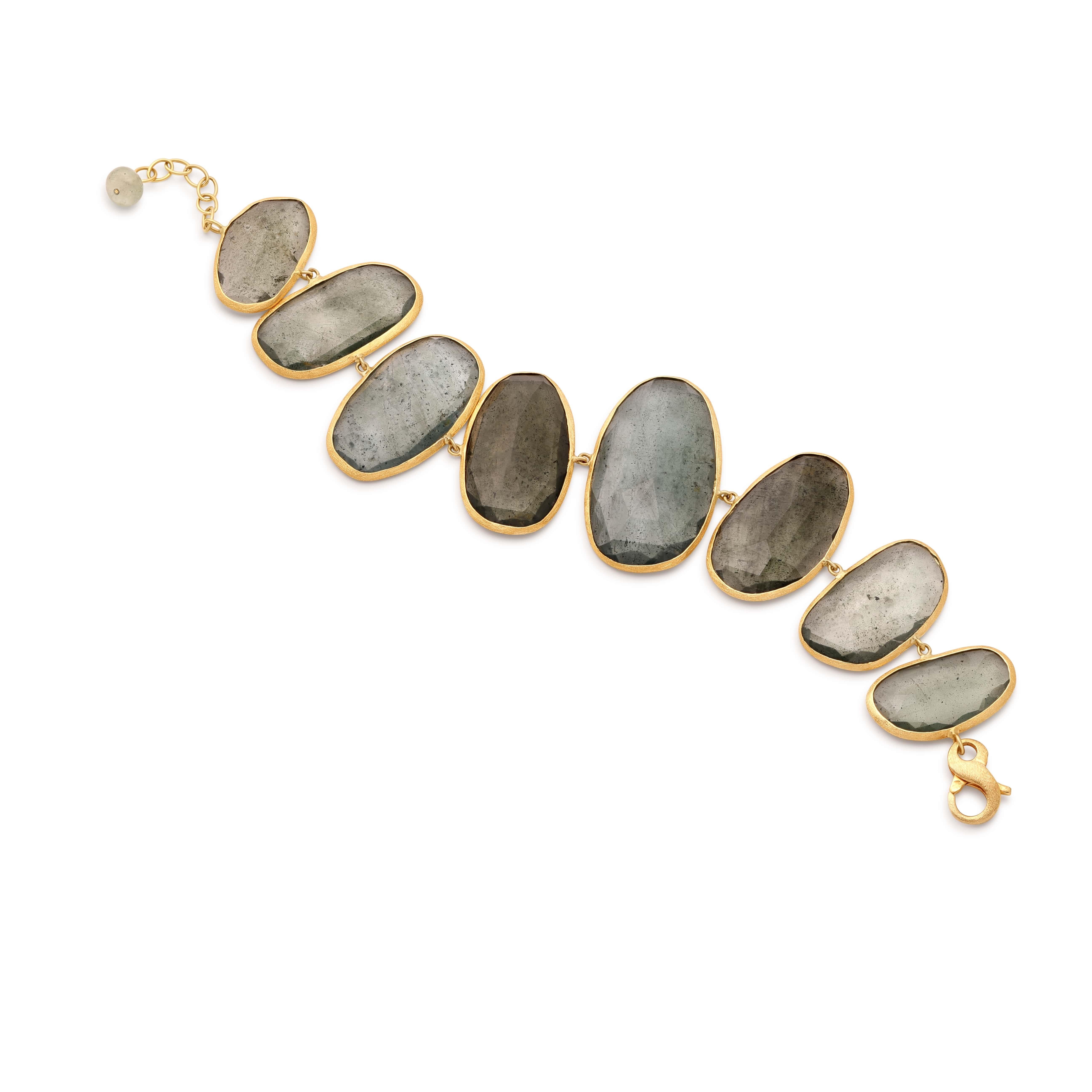 The Aqua Dawn Aquamarine Bracelet is a symphony of light, crafted with 130.00 ct. of serene aquamarines. Set in 18K yellow gold, each gem captures the tranquil essence of a morning sky, ranging from the clear horizon to the gentle grey of early