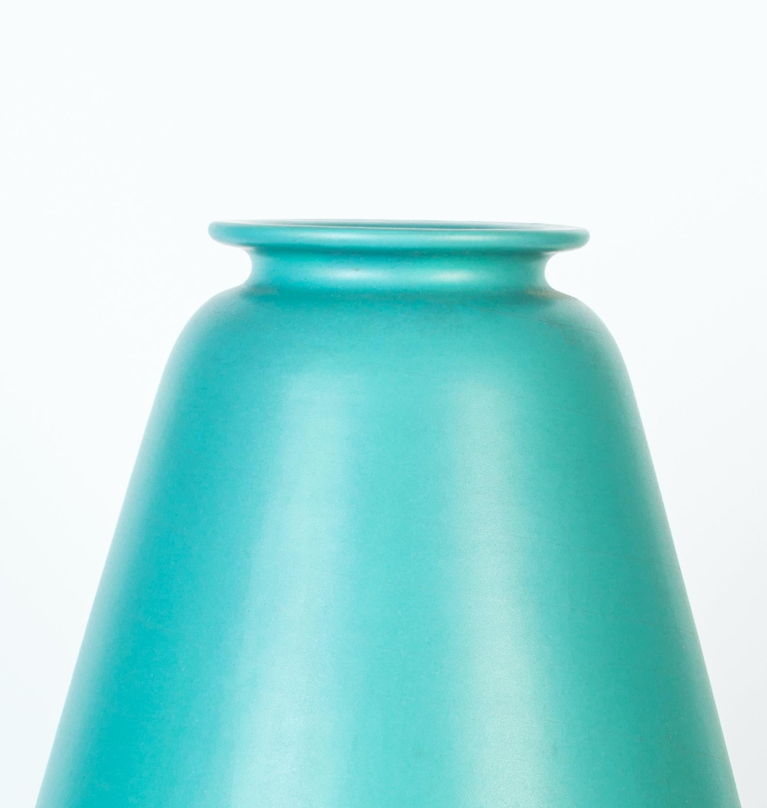 Aqua green ceramic vase is a vintage ceramic decorative object, realized during the 1950s. 

A very beautiful aqua green vase with a decoration on the higher part of the body and with black edge and handles.

This vase was realized by Ceramiche