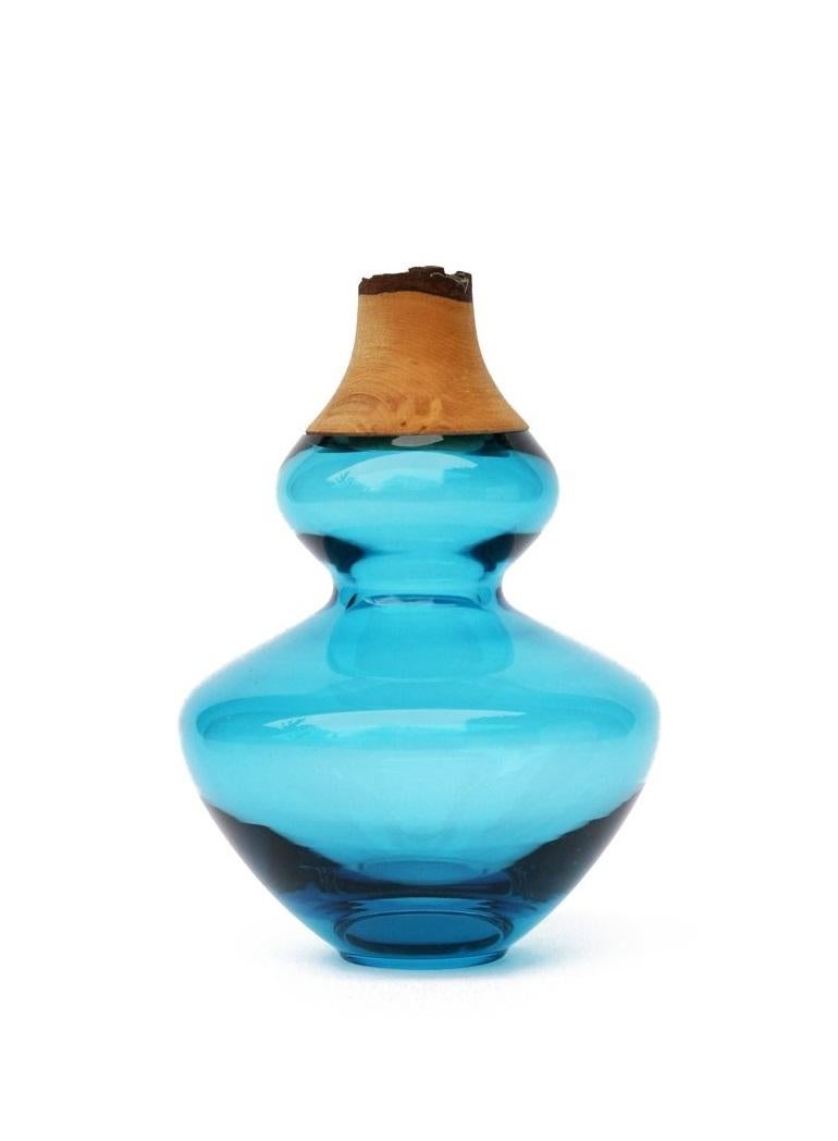 Aqua Inanna stacking vessel, Pia Wüstenberg
Dimensions: D 14.5 x H 22
Materials: glass, wood
Available in other colors.

Inanna is an ancient Mesopotamian goddess associated with love, beauty, justice and political power. A strong symbol for