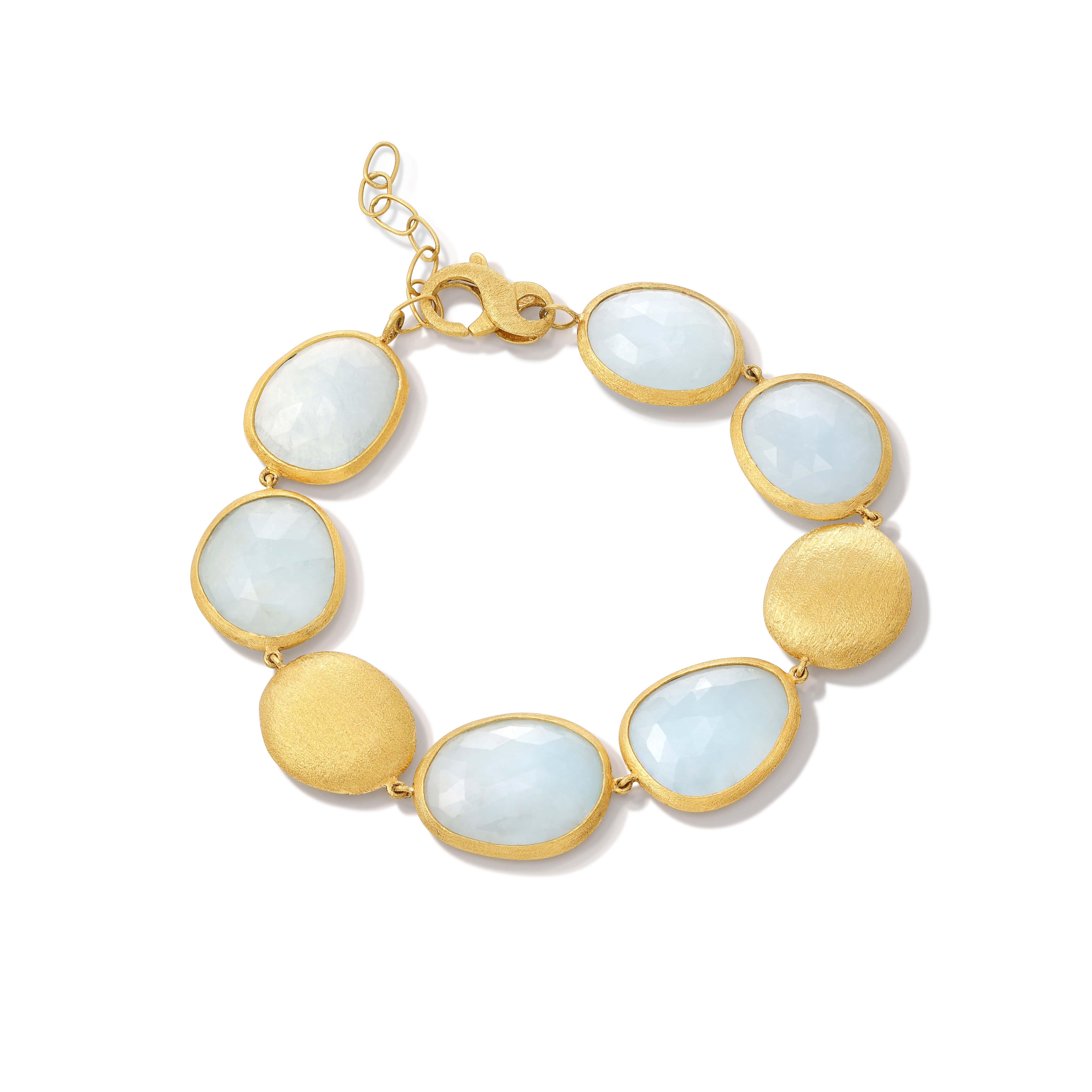 The Aqua Natural Aquamarine Bracelet weaves together the soothing energy of the sea with the radiance of dawn. This exquisite bracelet features 40 ct. of natural aquamarine stones, each enshrined in 18K yellow gold. The soft blue hues of the