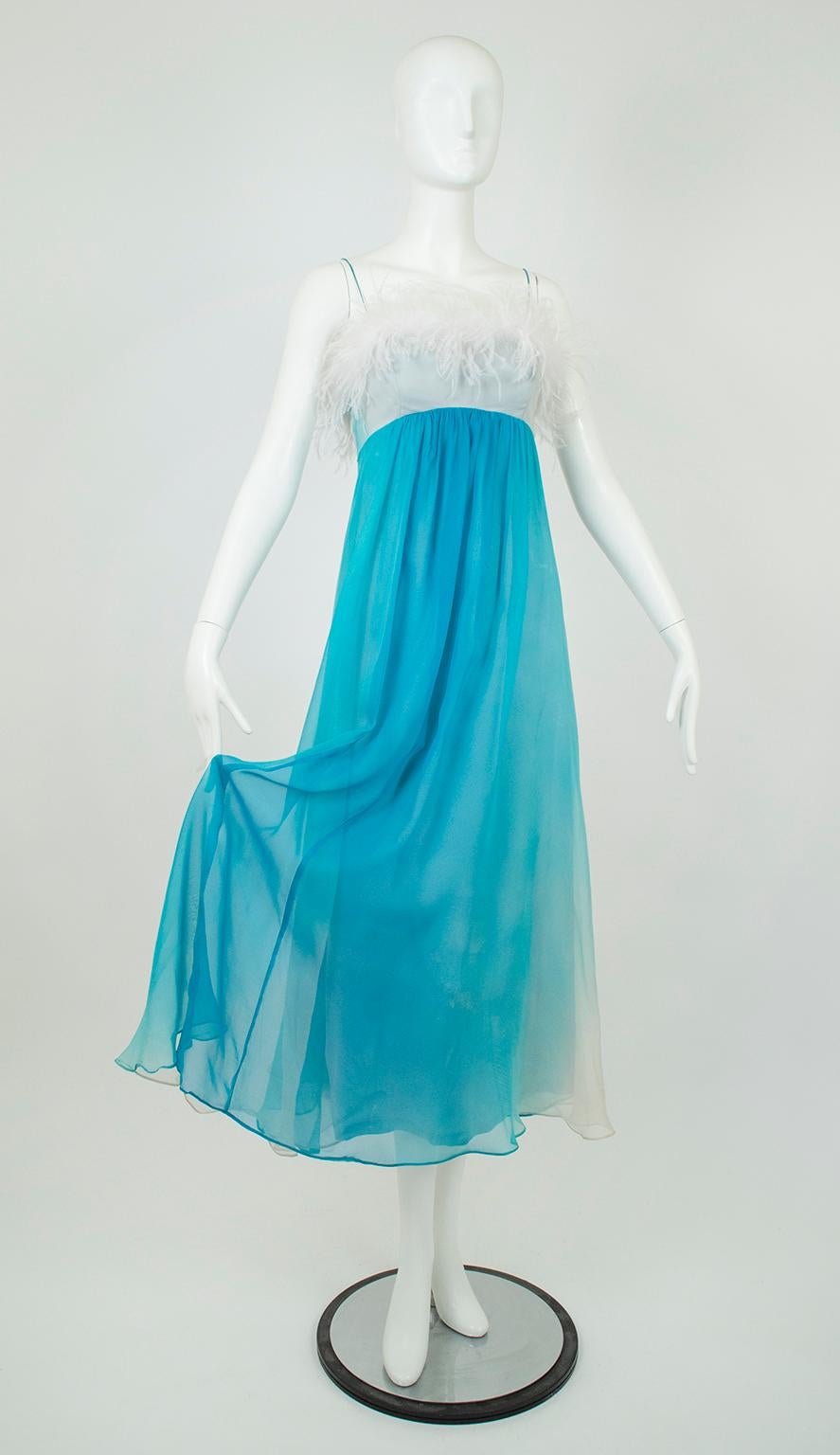 A gown worthy of a dance number with Fred Astaire, this dress has drama by the handful.  Yards of swirling chiffon and feathers provide nonstop movement, while the rich ombré tye dye effect creates pools of depth.  If movie star glamour is your