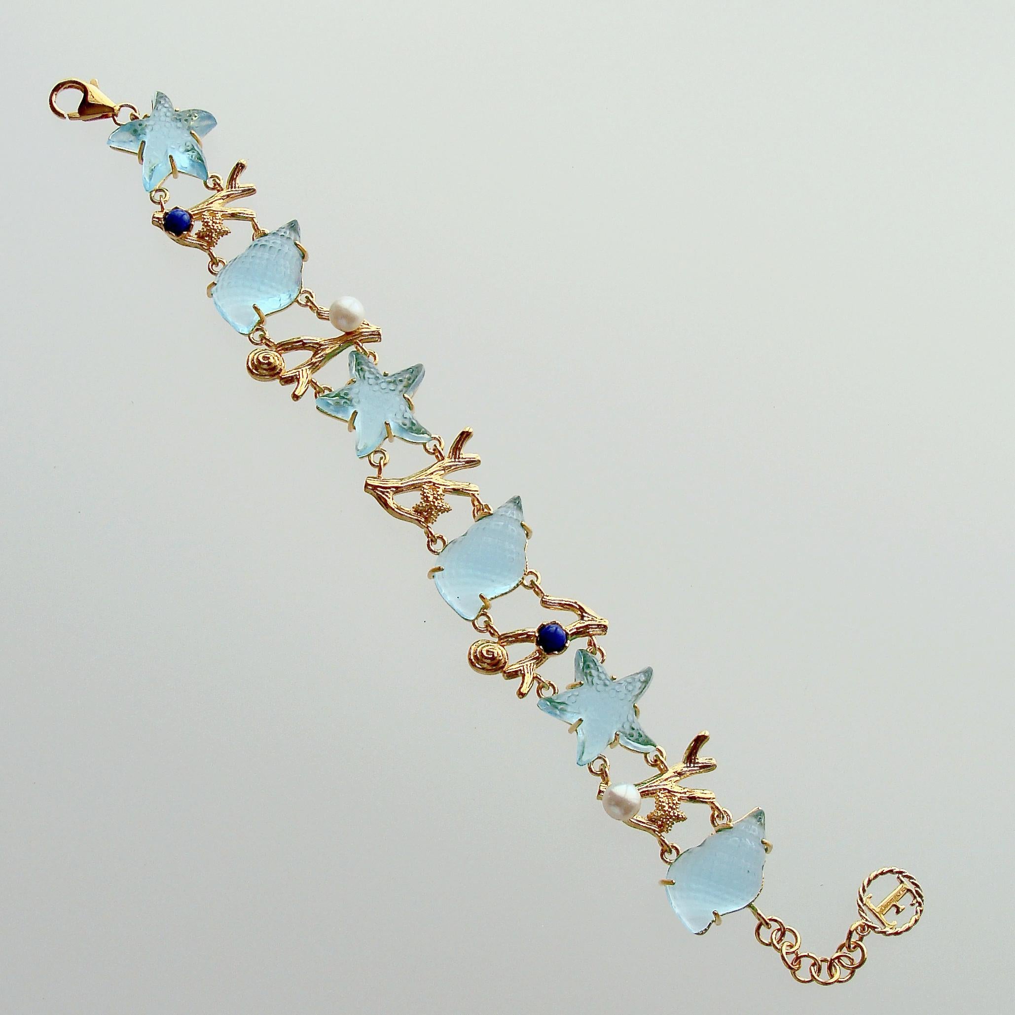 As life seems to be going back to a more normal situation and with the blistering heat of the summer, we are drawn to the ocean on lazy days filled with salt, sea and sand.  This precious bracelet created from Venetian glass conch shells and