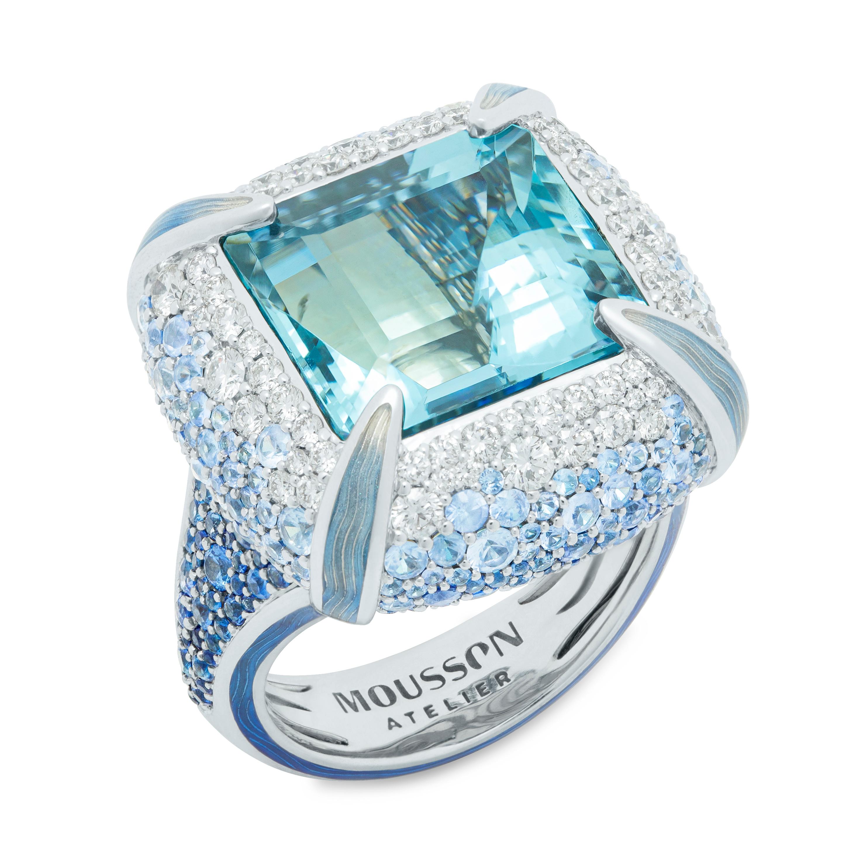Aquamarine 11.39 Carat Diamonds Sapphires Enamel 18 Karat White Gold Ring
What images come to your mind when you see this Ring? It is a snow princess outfit or maybe melting ice? Whatever it is, the cold perfection in this is clearly visible, agree?