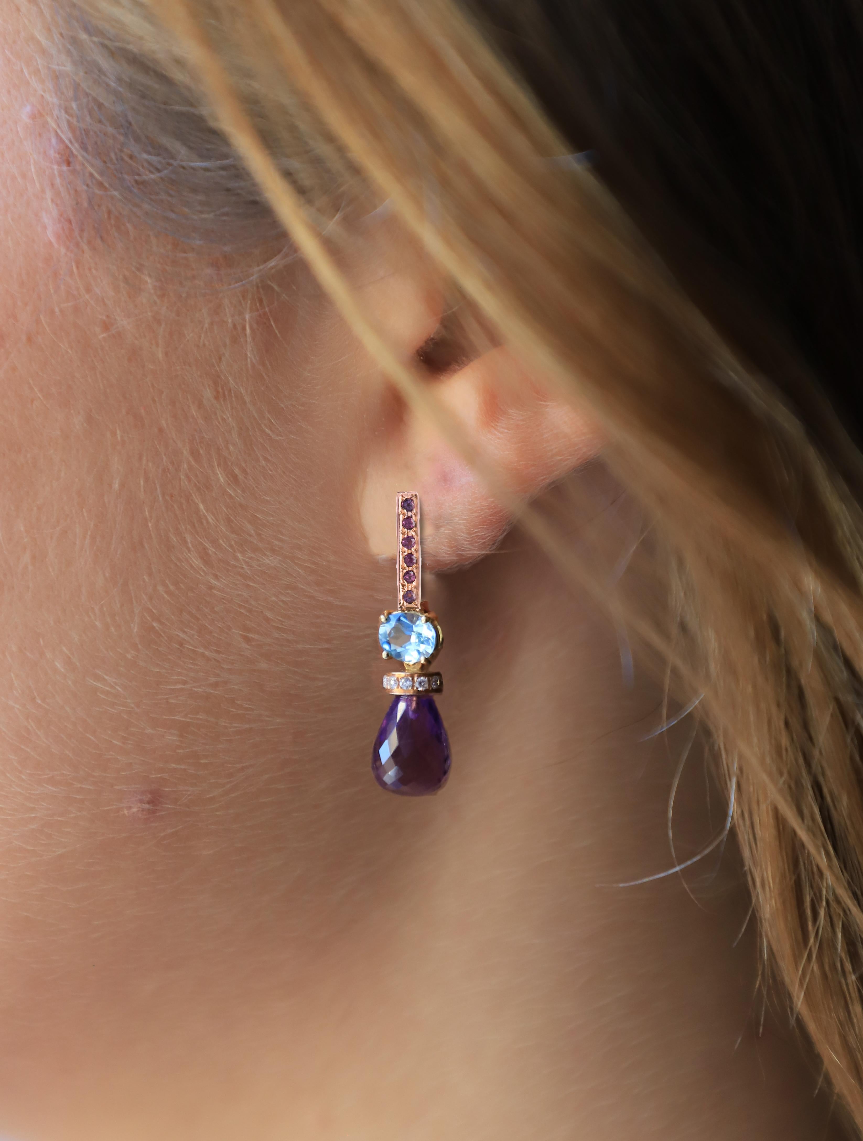 4 Karats Aquamarine 18 Karat Rose and White Gold Brilliant Cut 0.14 Karats White Diamonds Amethyst Drops 0.30 Karats Pink Sapphires Dangle Earrings 
A beautiful pair of dangle earrings handcrafted in 18 karats rose and white gold, embellished with
