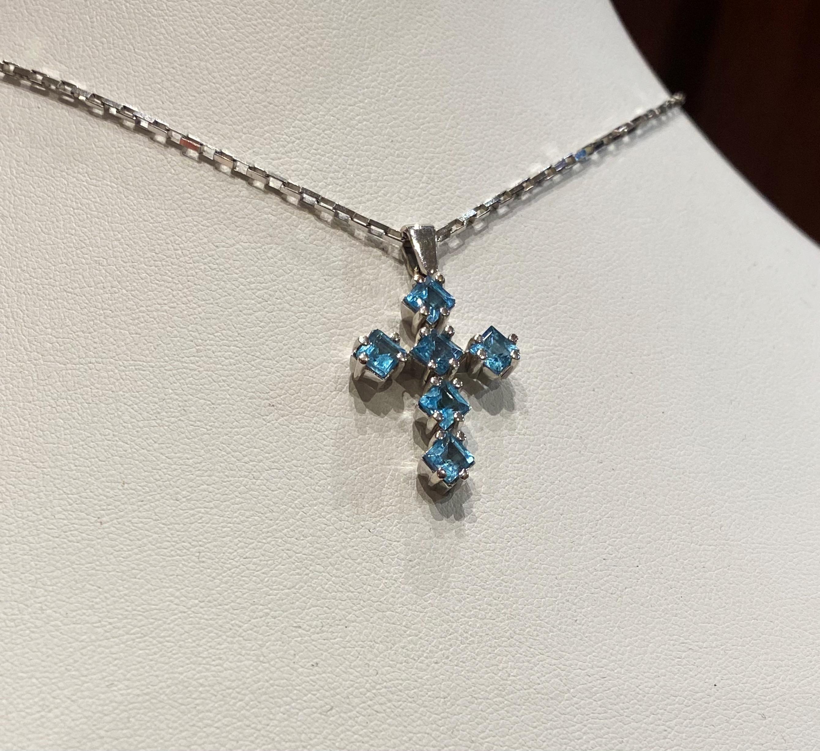 This vintage piece is an epitome of understated elegance

Cross Pendant set with 6 Natural Aquamarines
of desirable square cut,
of distinctive & striking sky-blue colour
(which looks even more beautiful against the skin)
of 2.50ct in total approx.