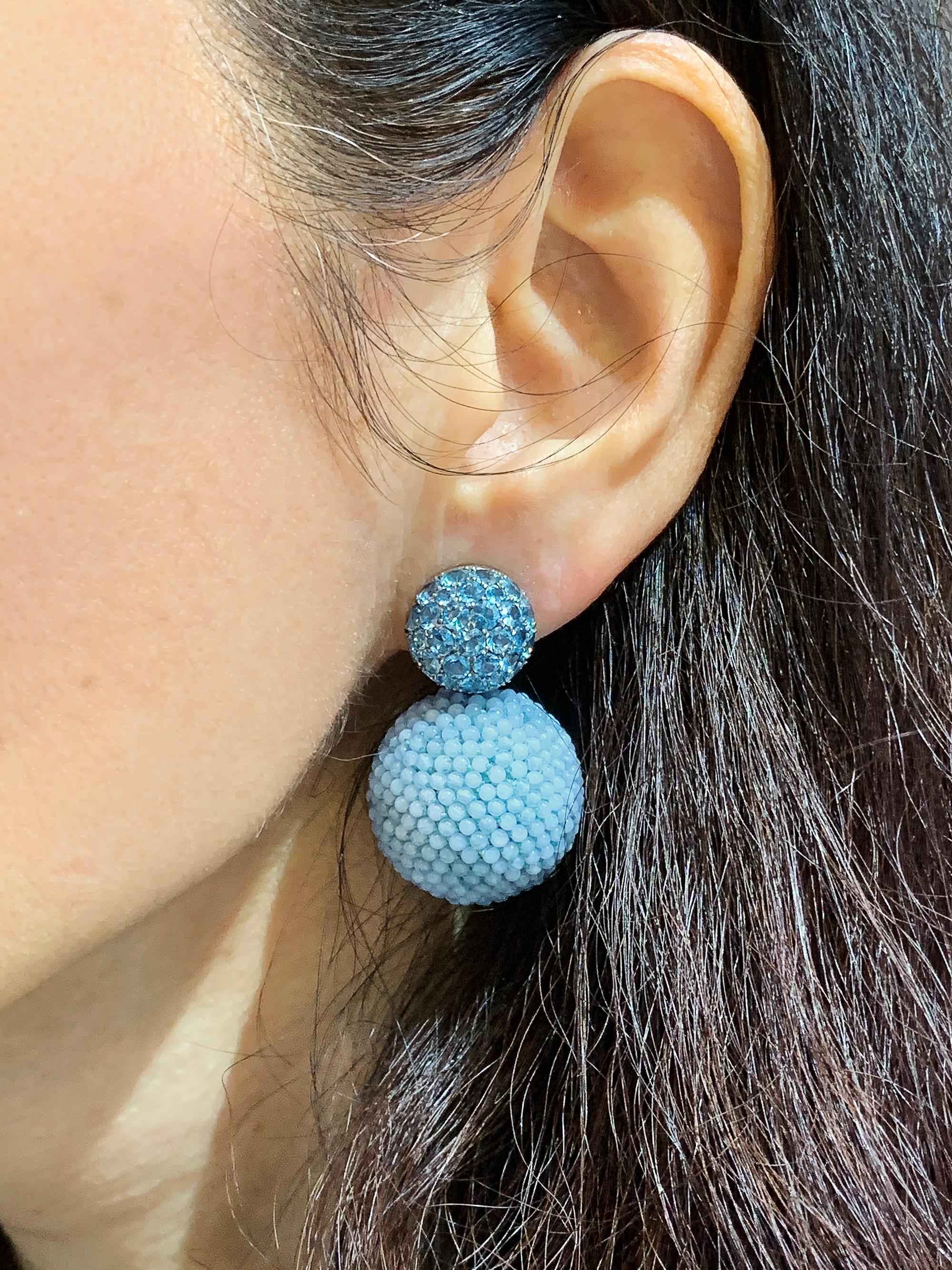 Hemmerle's Aquamarine Blue Agate Ball Earrings, crafted in 18K white gold circa 2000, showcase the German house's innovative approach. The earrings feature sparkling pavé-set round aquamarines atop intricately woven boules with lace agate beads,