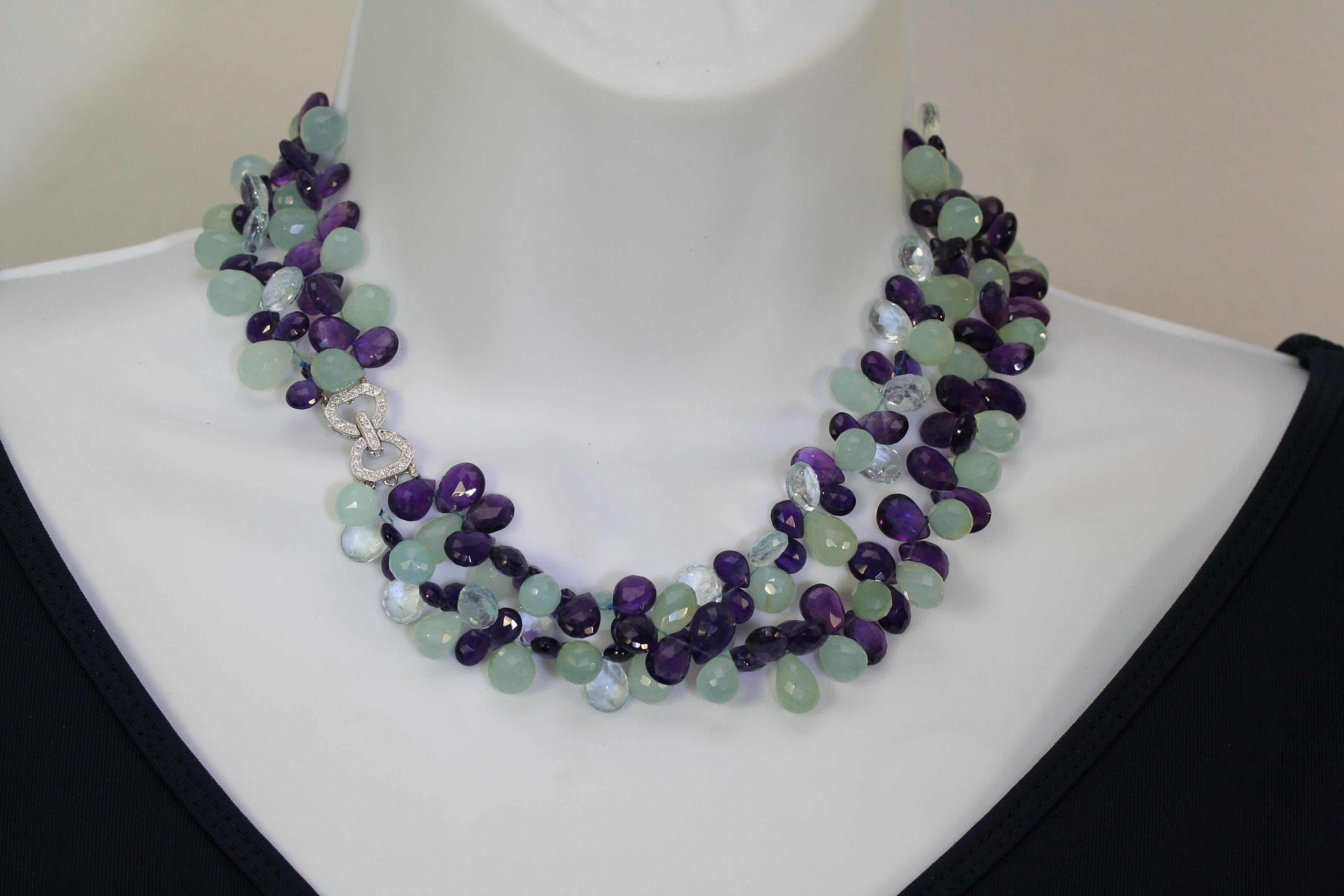 Exquisite two-strand necklace of blues to purple faceted semi-precious stones secured with an 18k white gold clasp paveed with diamonds. This beauty speaks for itself.  The color combination is outstanding and the quality will take its place among