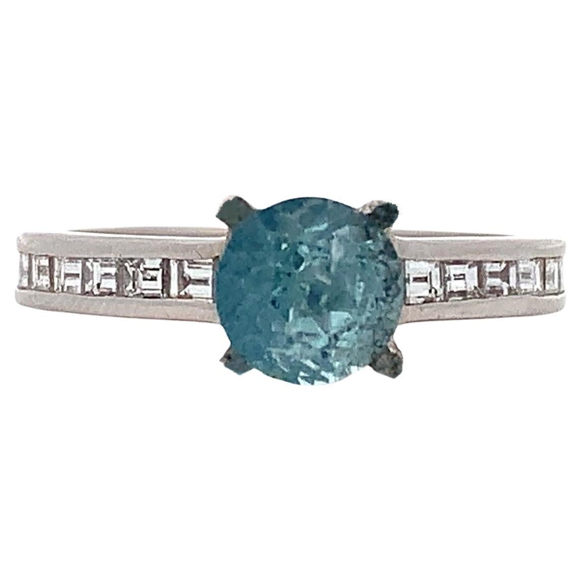 Aquamarine and baguette diamonds engagement ring in platinum