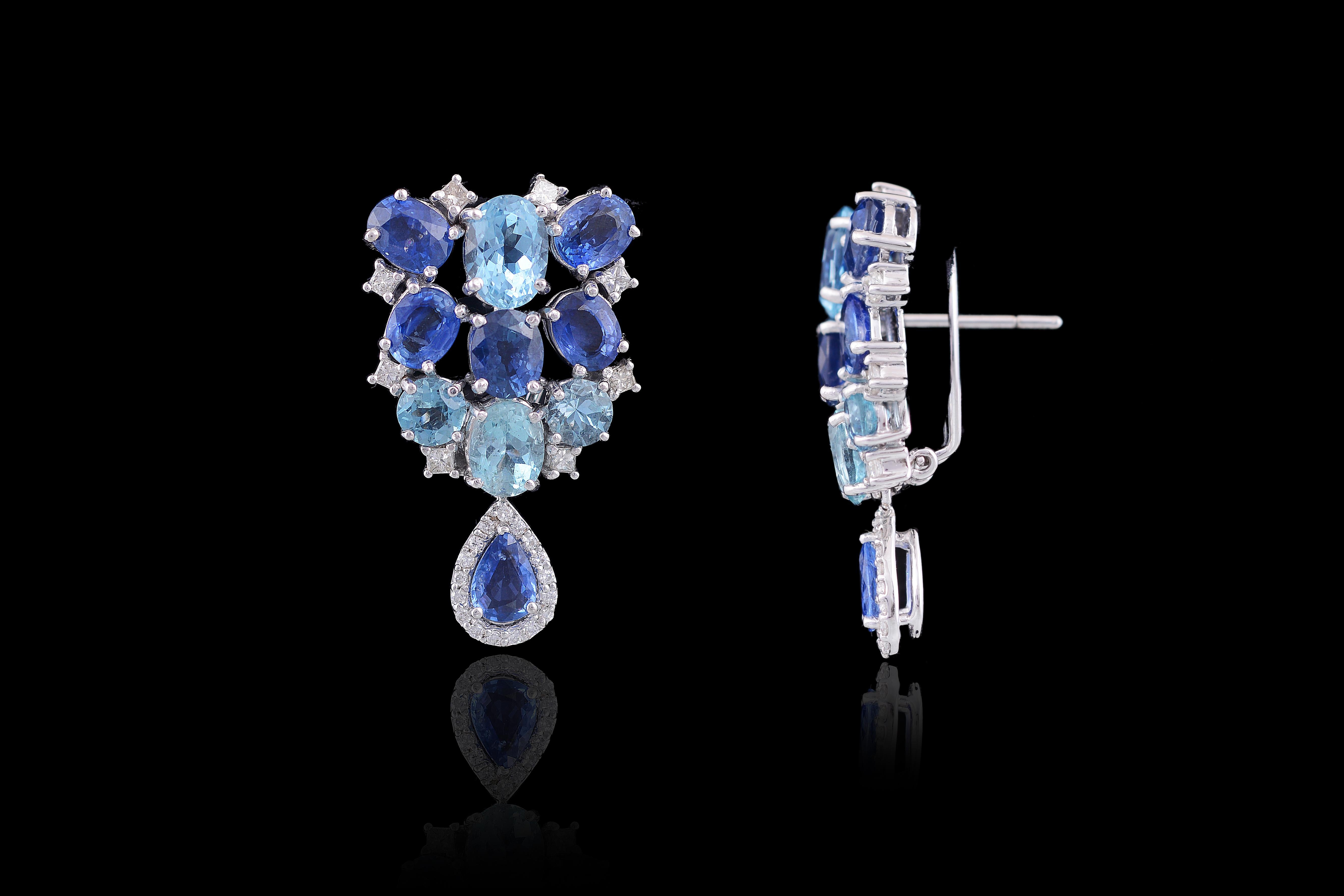 A very good looking yet unusual pair of fine earrings in Aquamarine and Ceylon Blue Sapphire with back clip and push pull backing set in 18 Karat White Gold and diamonds.