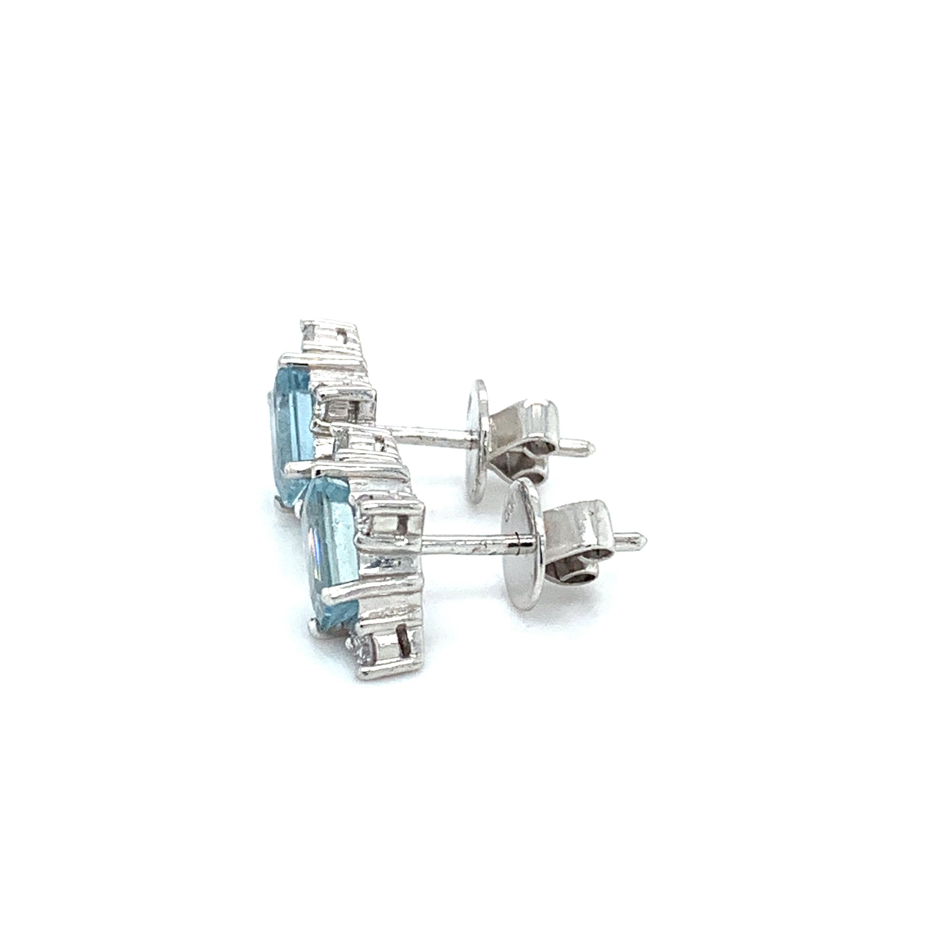 3.40ct Aquamarine diamond art deco stud earrings 18k white gold.
Composed of emerald cut aquamarine gemstone accented by round brilliant diamond in 18k white gold with butterfly settings.
Aquamarine gemstone approximately weighing 3.00 carat no