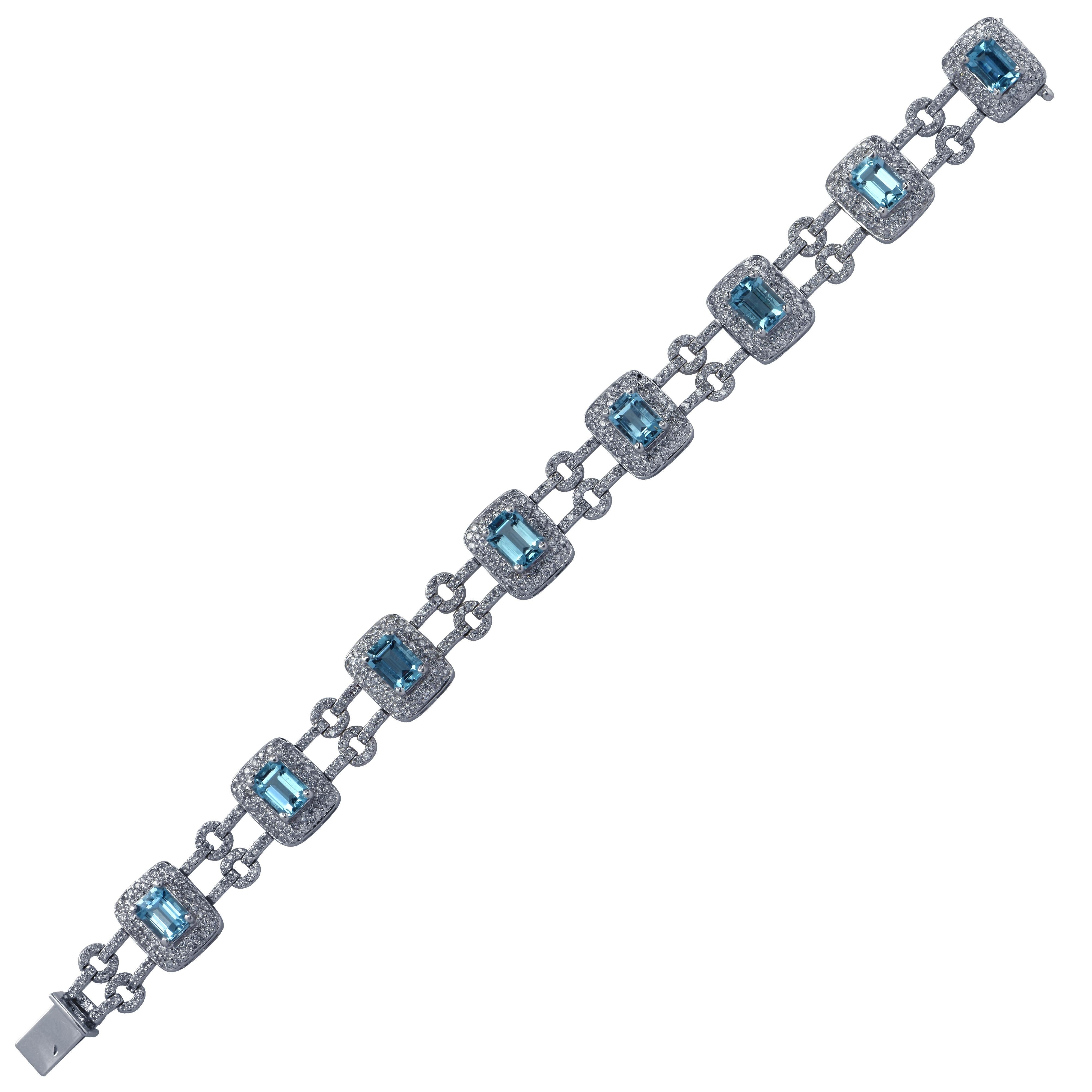 Beautiful bracelet crafted in 18 karat white gold, showcasing 8 emerald cut Aquamarines weighing approximately 8.25 carats total accented by 640 round brilliant cut diamonds weighing approximately 3.20 carats total G color VS clarity. Each