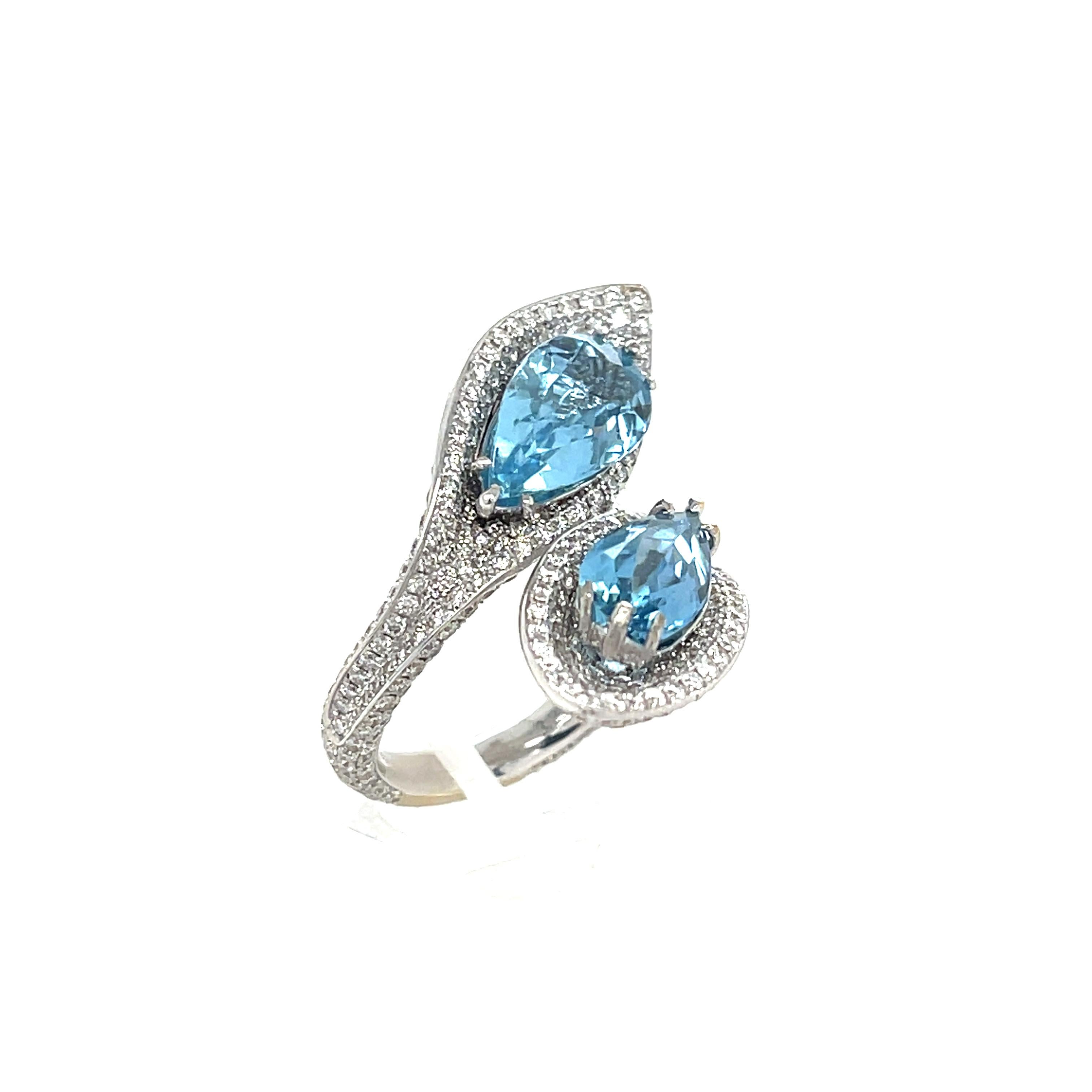 Aquamarine and Diamond Bypass Ring 18K White Gold. The ring features two pear shape aquamarines (3.23ctw) and pave set diamonds (3.13ctw). 
Ring Size 6.5
13.57 grams