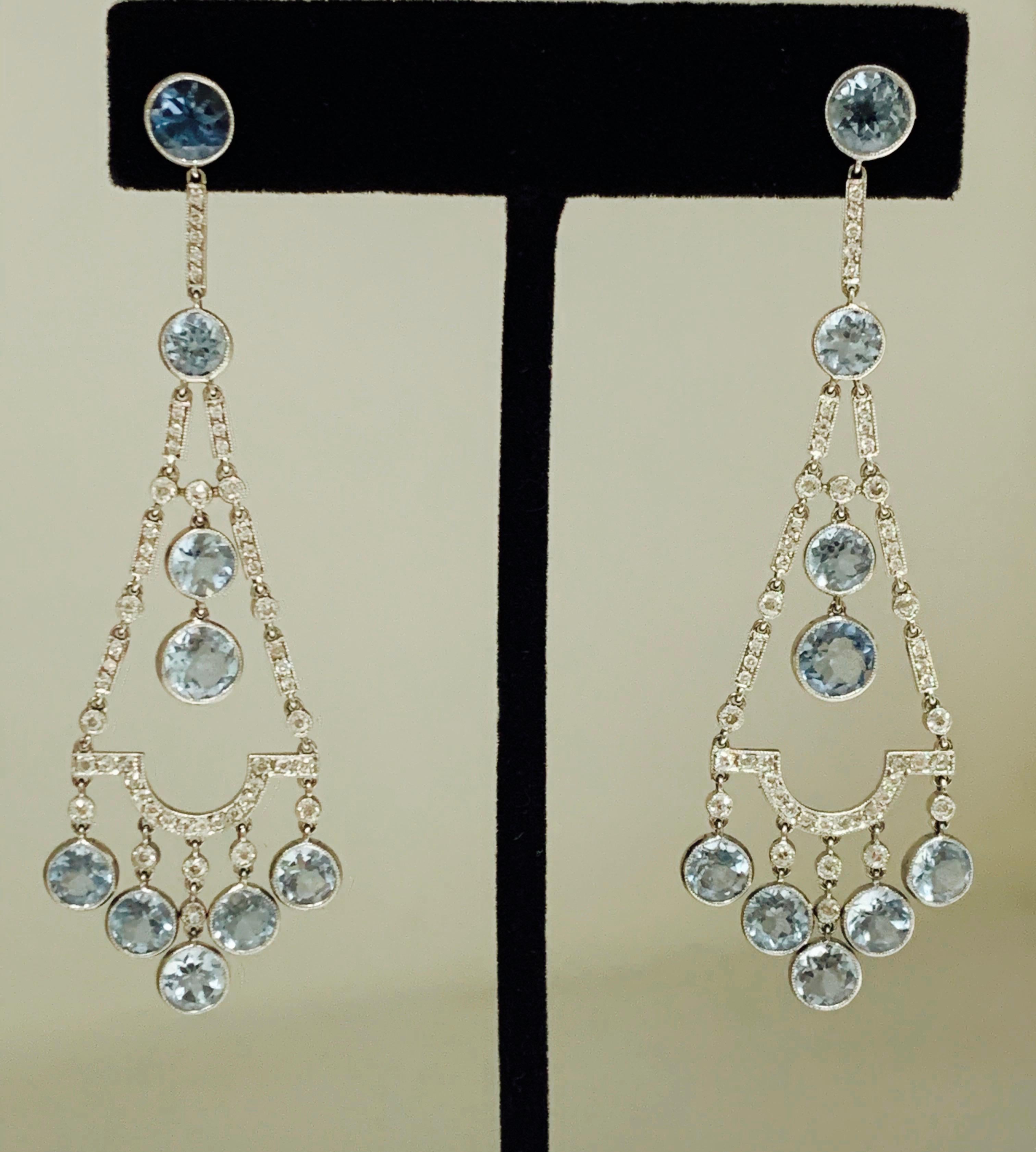 These one of a kind earrings are beautifully handmade in platinum. 
The details are as follows : 
Aquamarine weight : 8.75 carat 
Diamond weight : 1.50 carat ( GH color and VS clarity ) 
Metal : Platinum 
Measurements: 3 inches long 