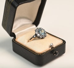 Aquamarine and Diamond Cluster Ring. 0.90 Round Cut Silver on 18K Yellow Gold