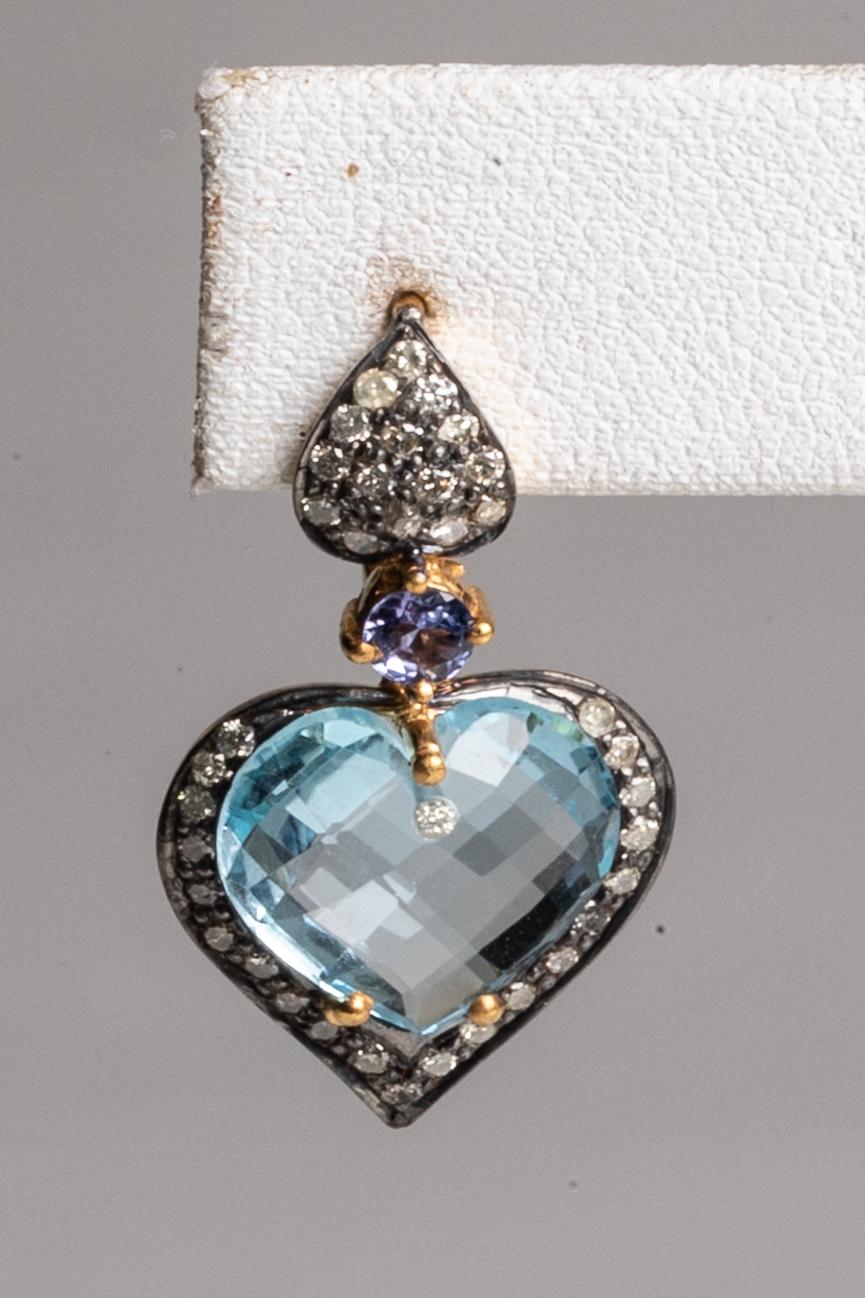 Lovely heart-shaped, faceted blue aquamarine bordered with round-cut pave`-set diamonds in sterling silver.  18K gold post for pierced ears.  All hand constructed.  

See The Lockhart Collection storefront here on 1st Dibs to see the collection of