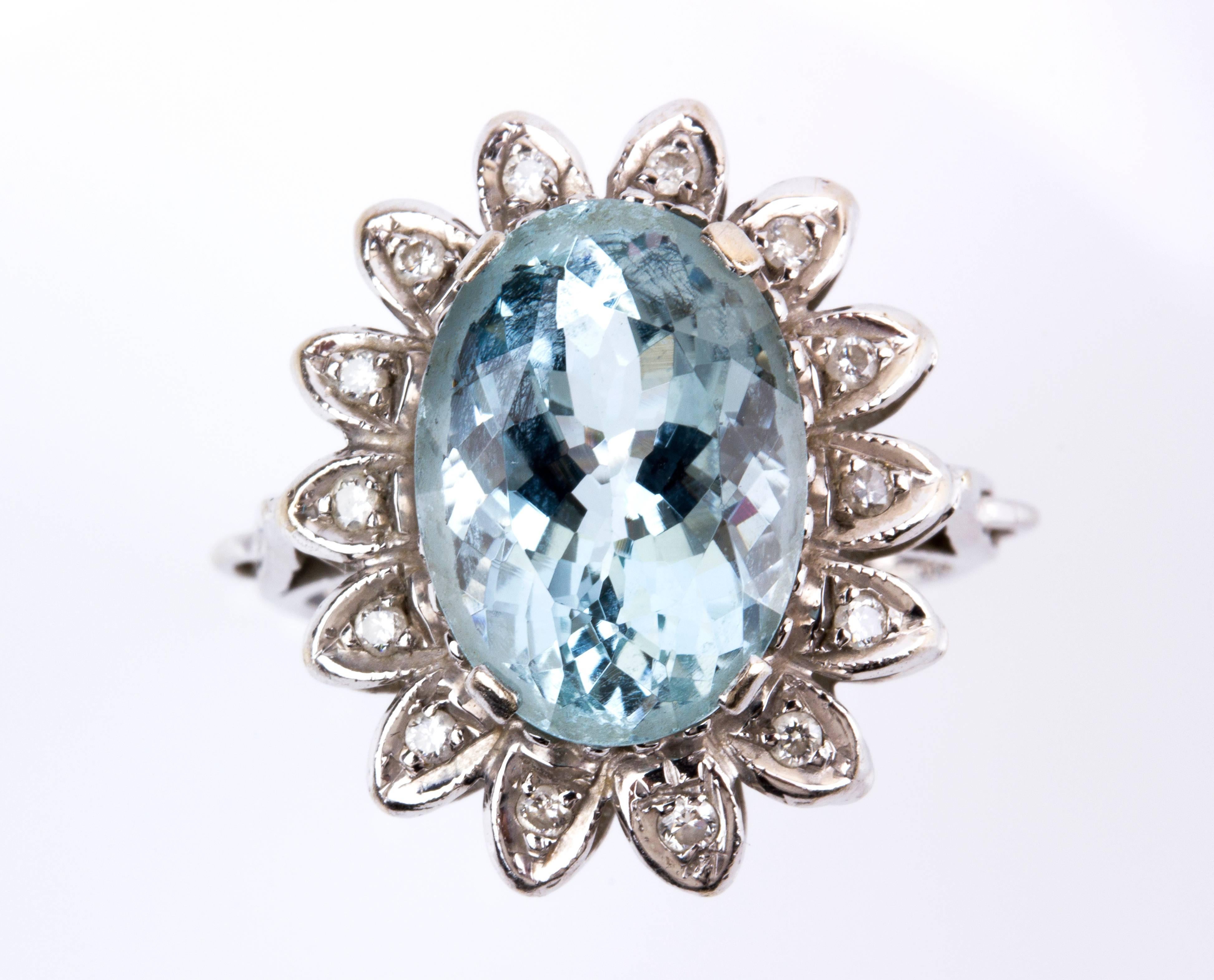Shaped as a flower, set 5.80 ct aquamarine, petals embellished with diamond weighing 0.20 ct, VS/SI clarity, G color. Size US 7.5 
