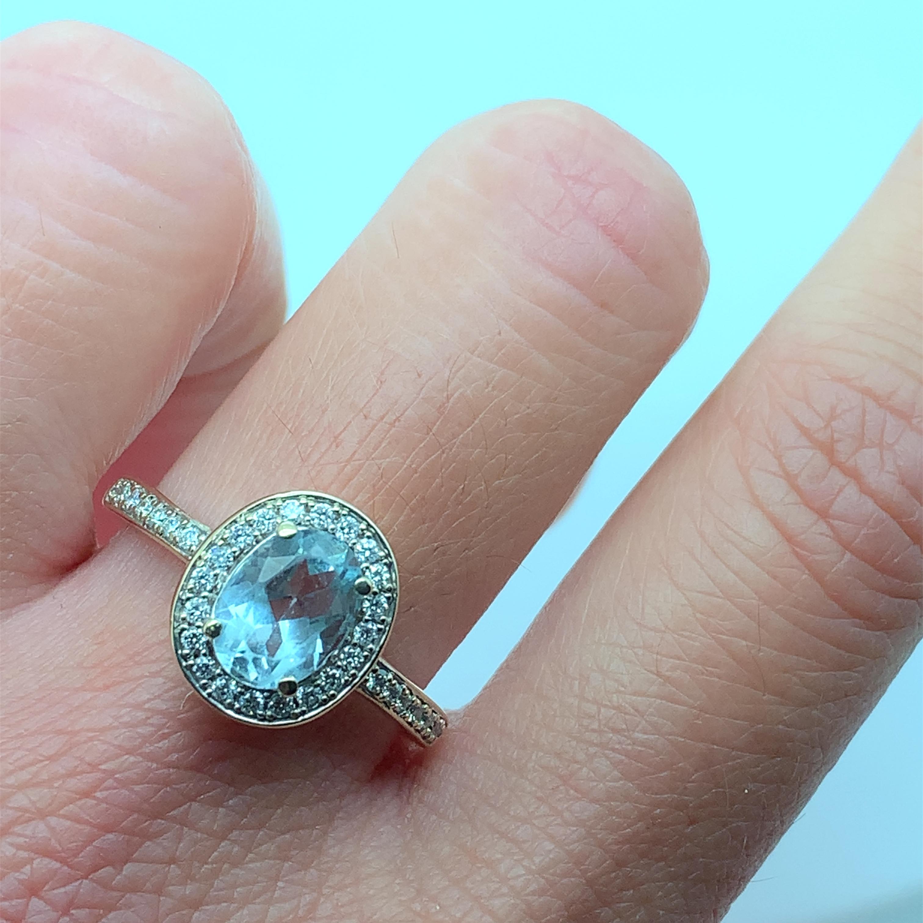 Modern Aquamarine and diamond halo engagement ring white gold For Sale