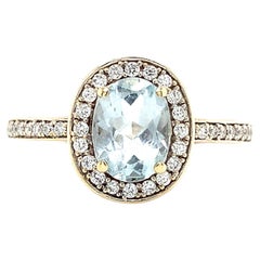 Anello di fidanzamento con aureola di acquamarina e diamanti in oro bianco