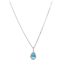 Aquamarine and diamond halo pear shaped drop pendant necklace white gold