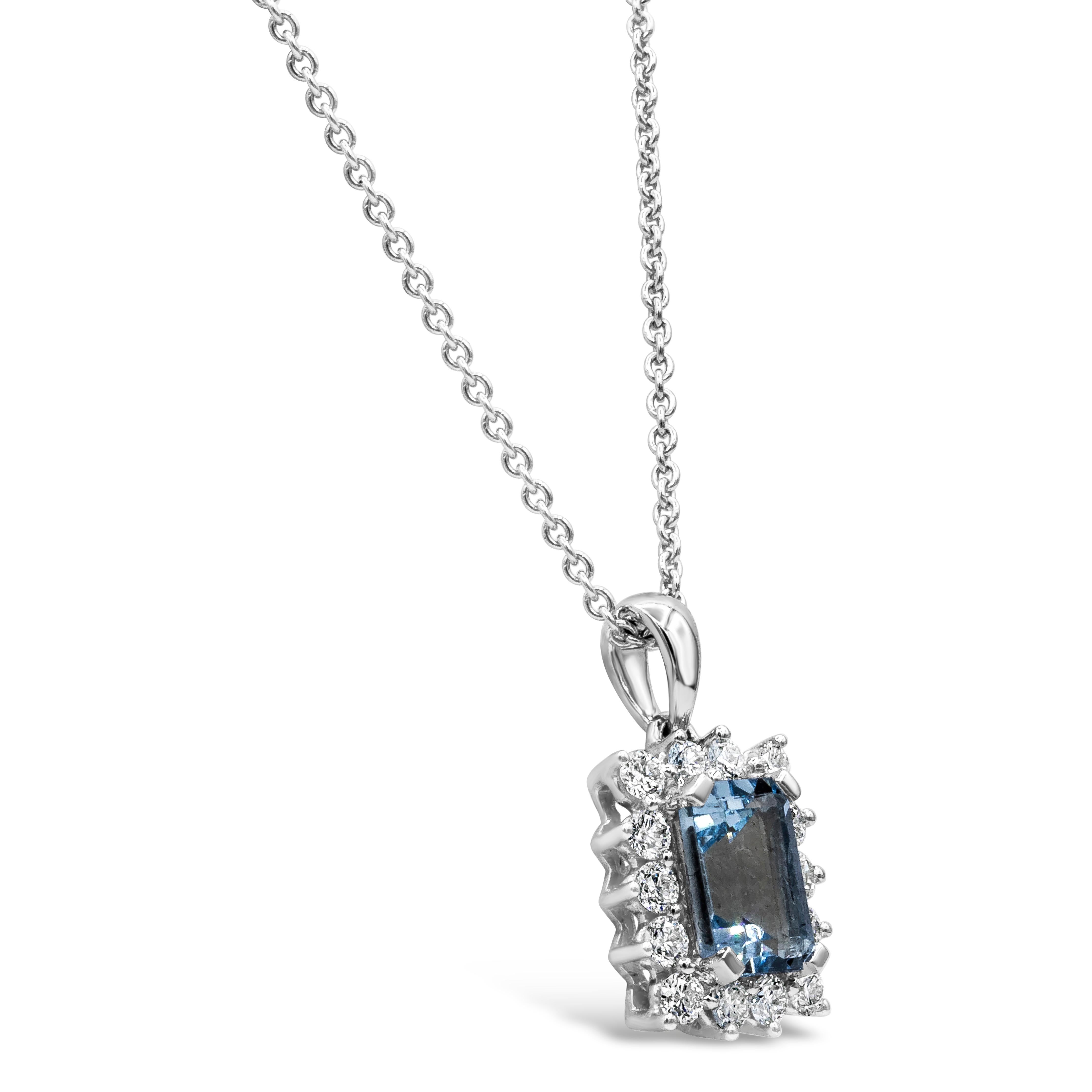Features a 0.95 carat aquamarine, surrounded by a single row of round brilliant diamonds. Diamonds weigh 0.35 carats total. Made in 18 karat white gold. Suspended on a 16 inch chain (adjustable upon request).

