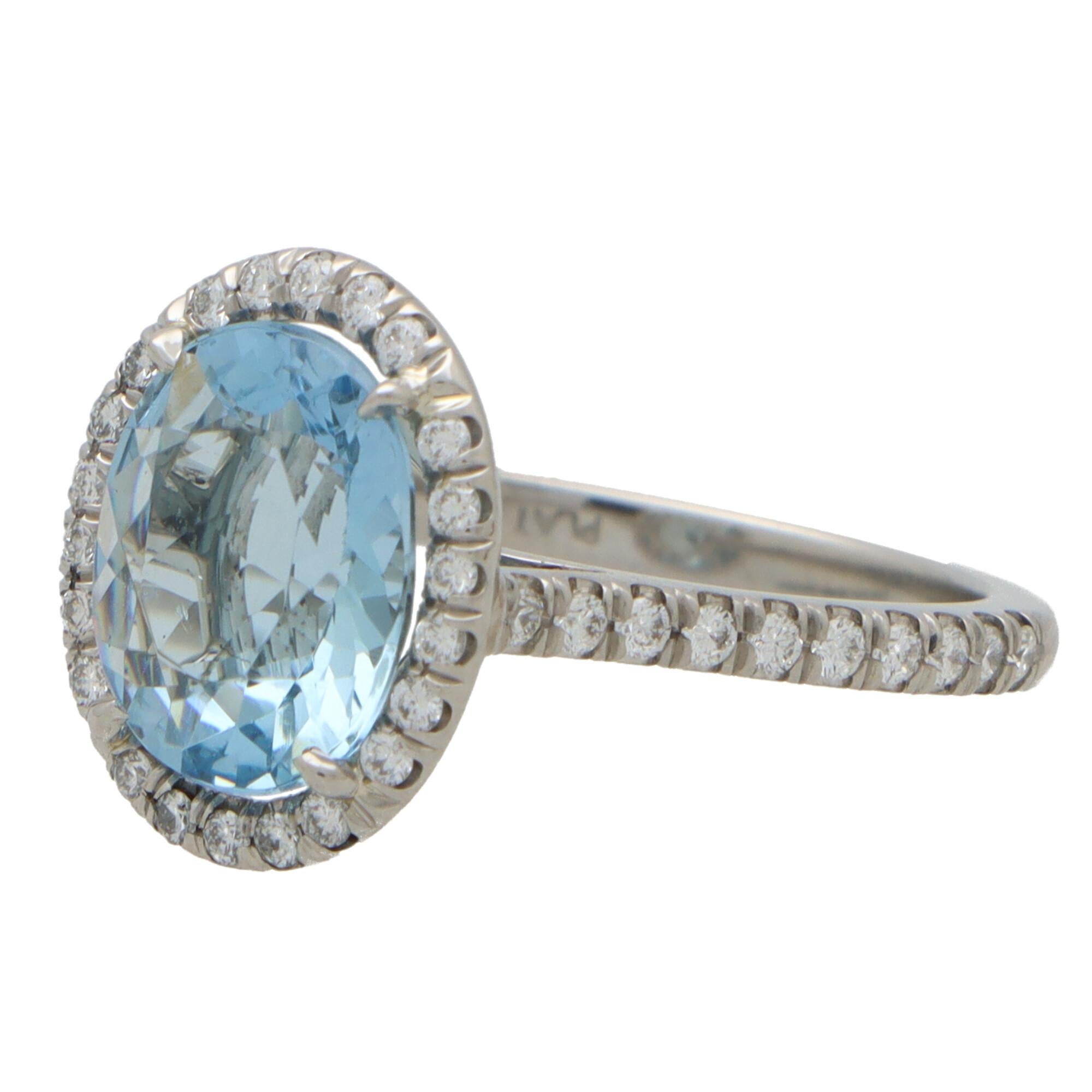 Oval Cut Aquamarine and Diamond Halo Ring in Platinum