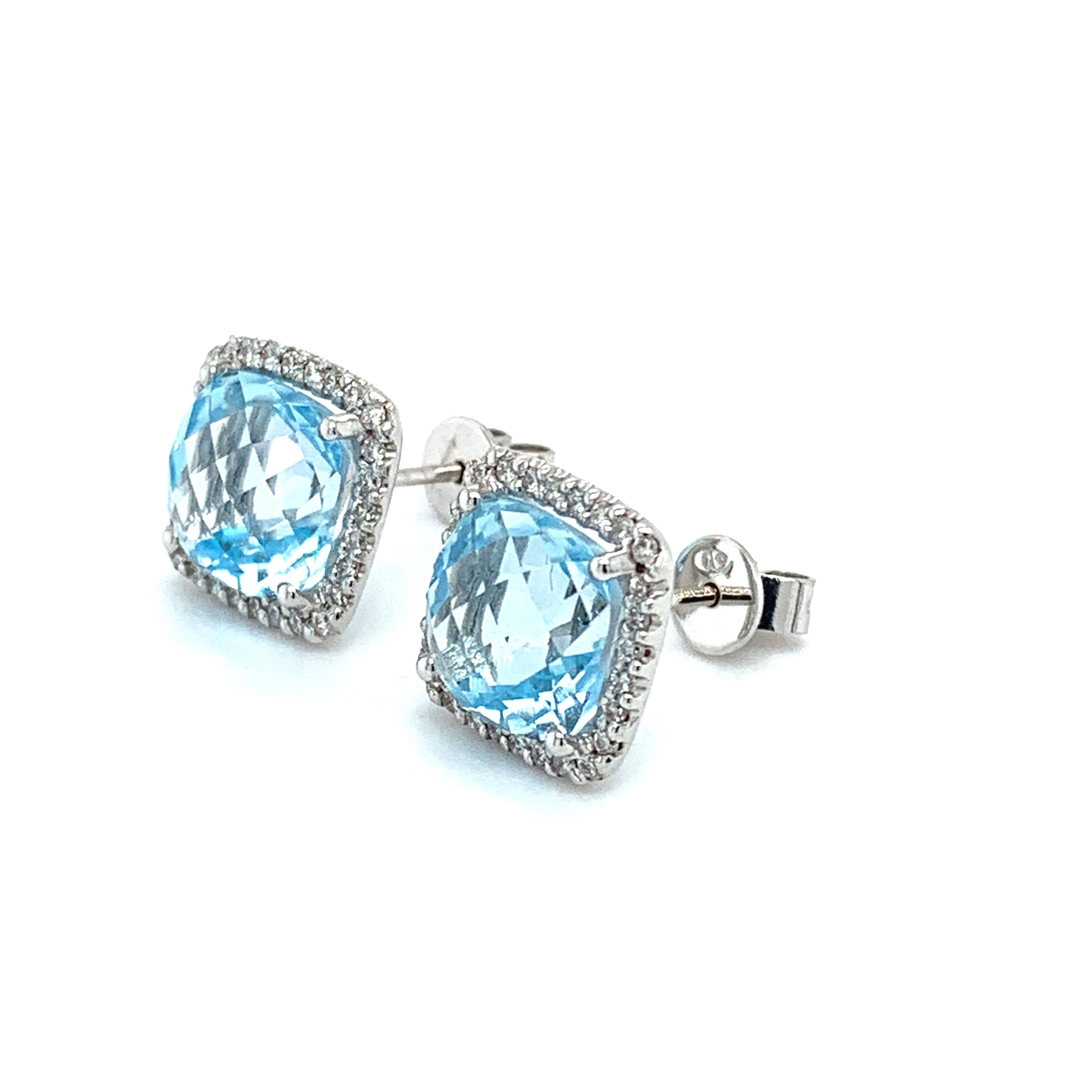 Aquamarine and diamond halo studs earrings in 18ct white gold.
Beautiful sky blue aquamarine gemstone cushion shaped natural untreated gemstones with soft corners accented by round brilliant cut diamonds around it all set in 18ct white gold
Total