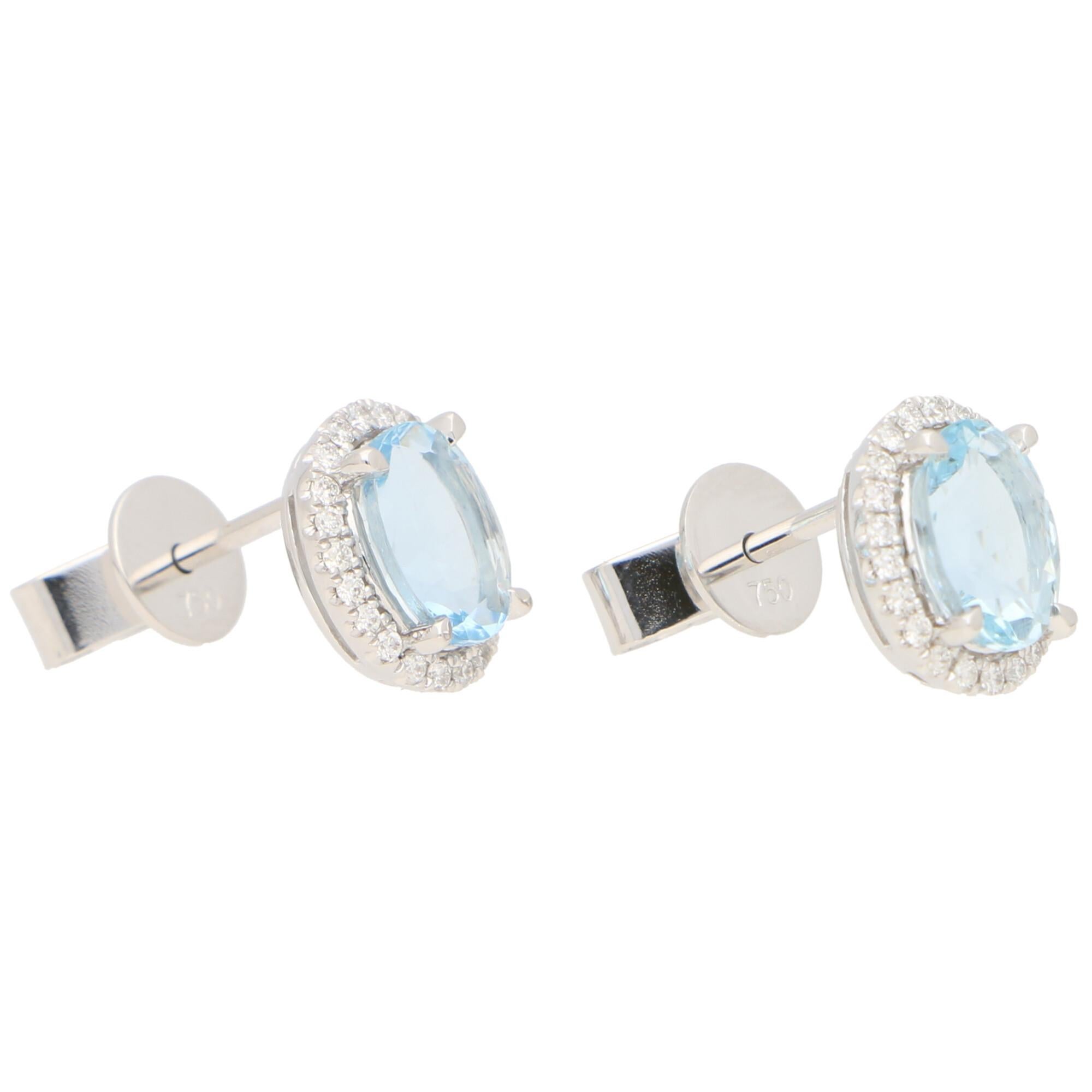 Modern Aquamarine and Diamond Halo Stud Earrings Set in 18k White Gold